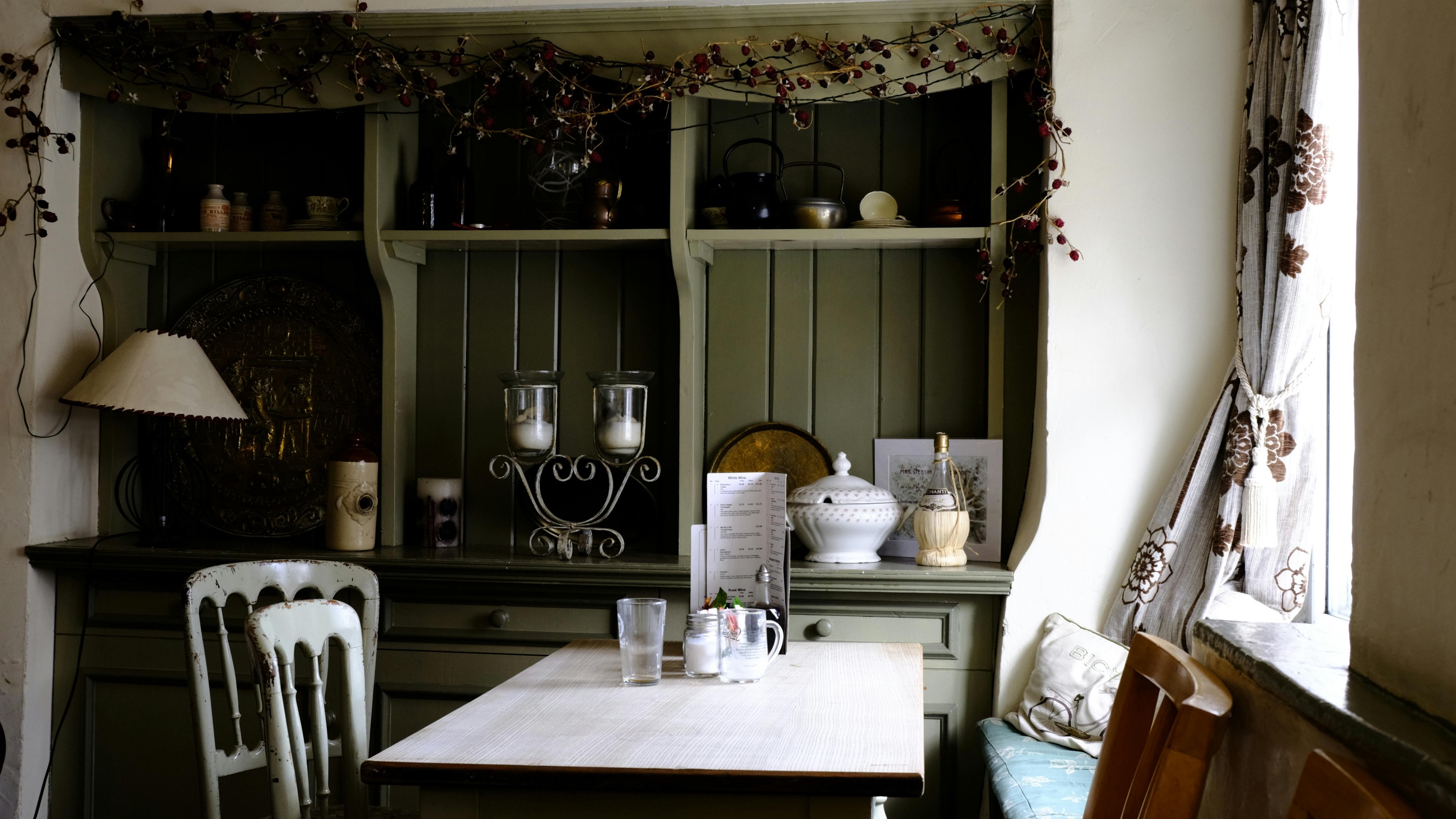 Elegant cottagecore home kitchen design with fruit decor.