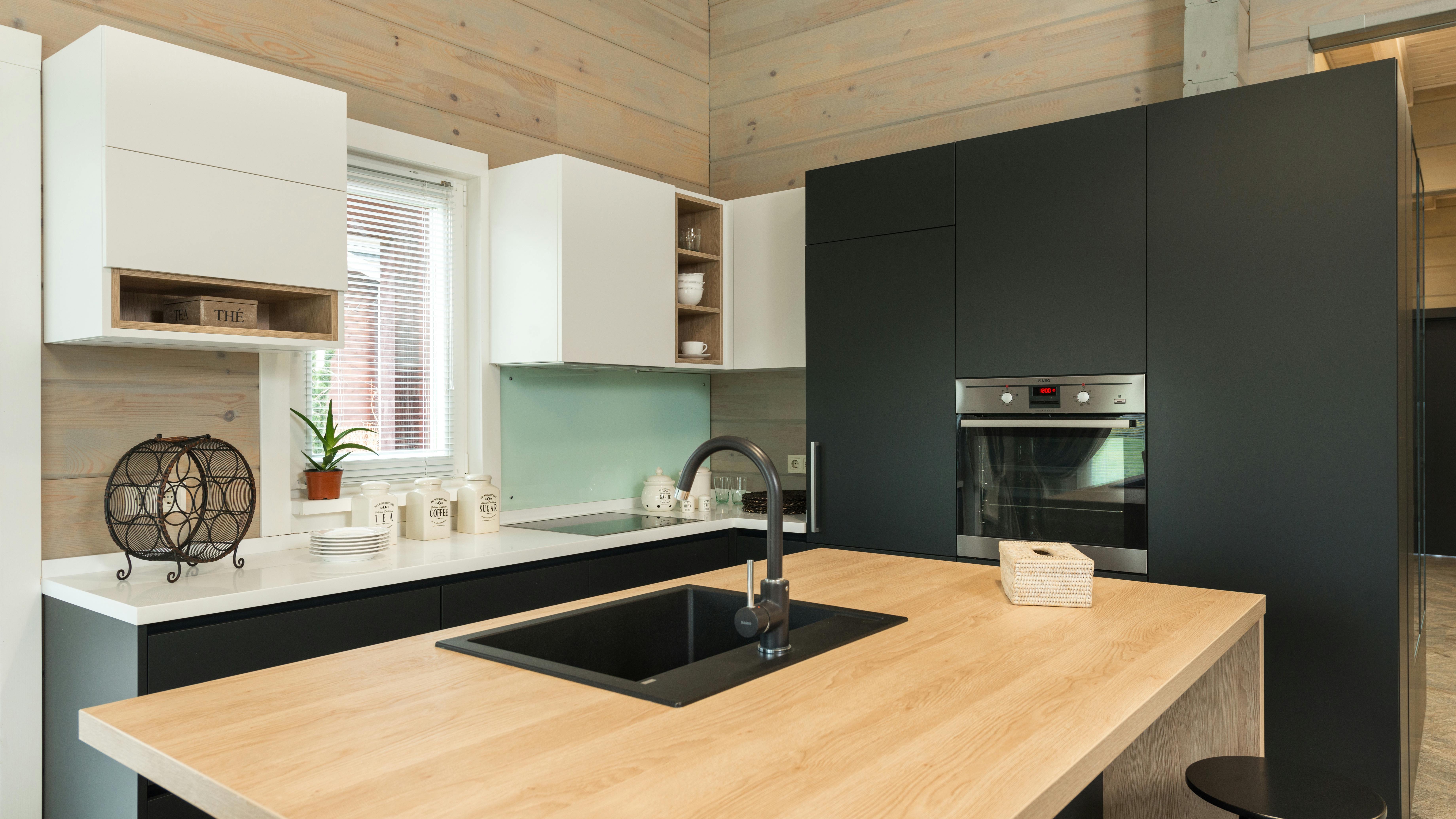 Sleek modern kitchen, luxurious design with chandelier, 2026 trends.