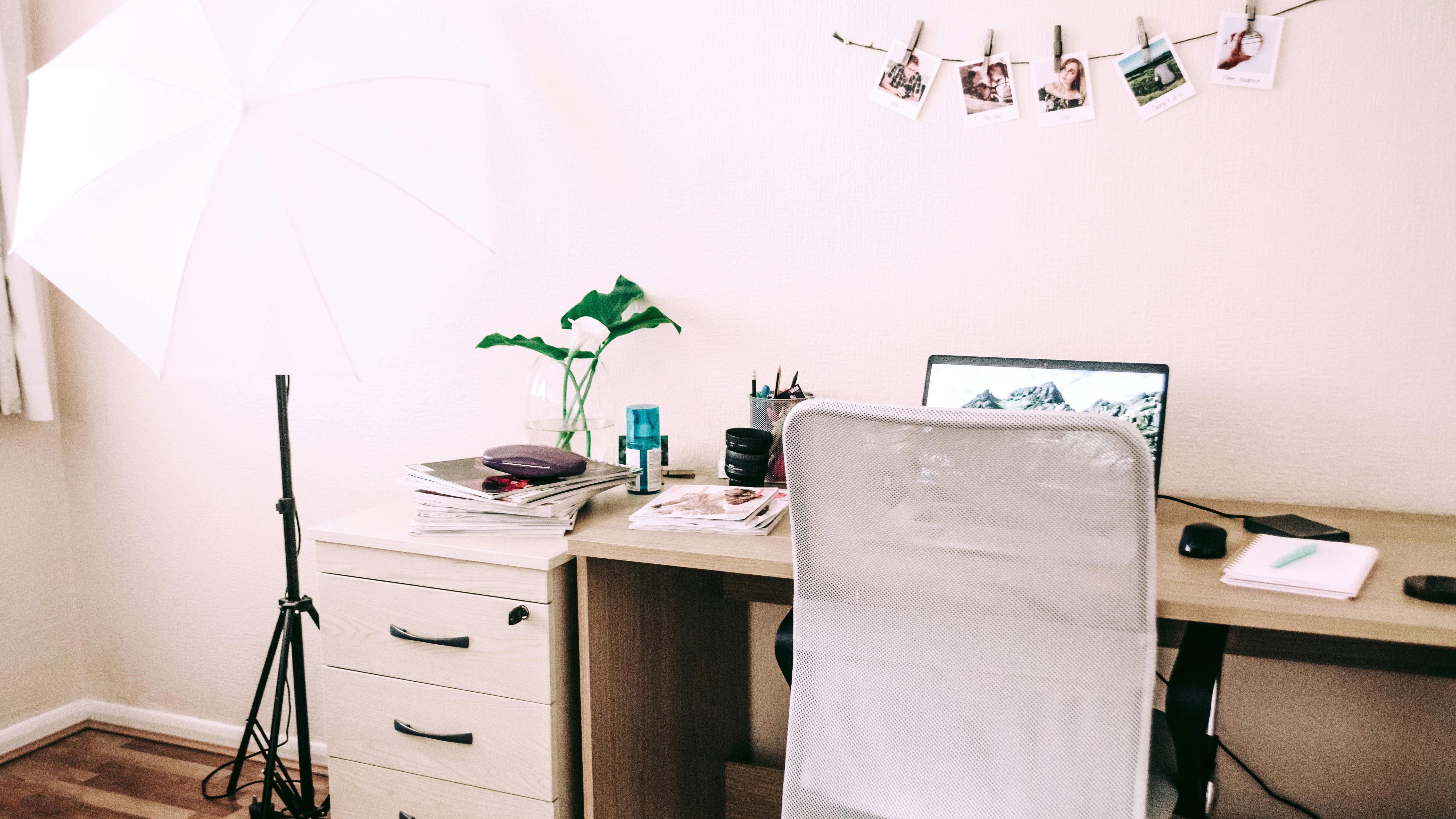 Modern living room with stylish furniture and plants, rearranging your workspace late at night.