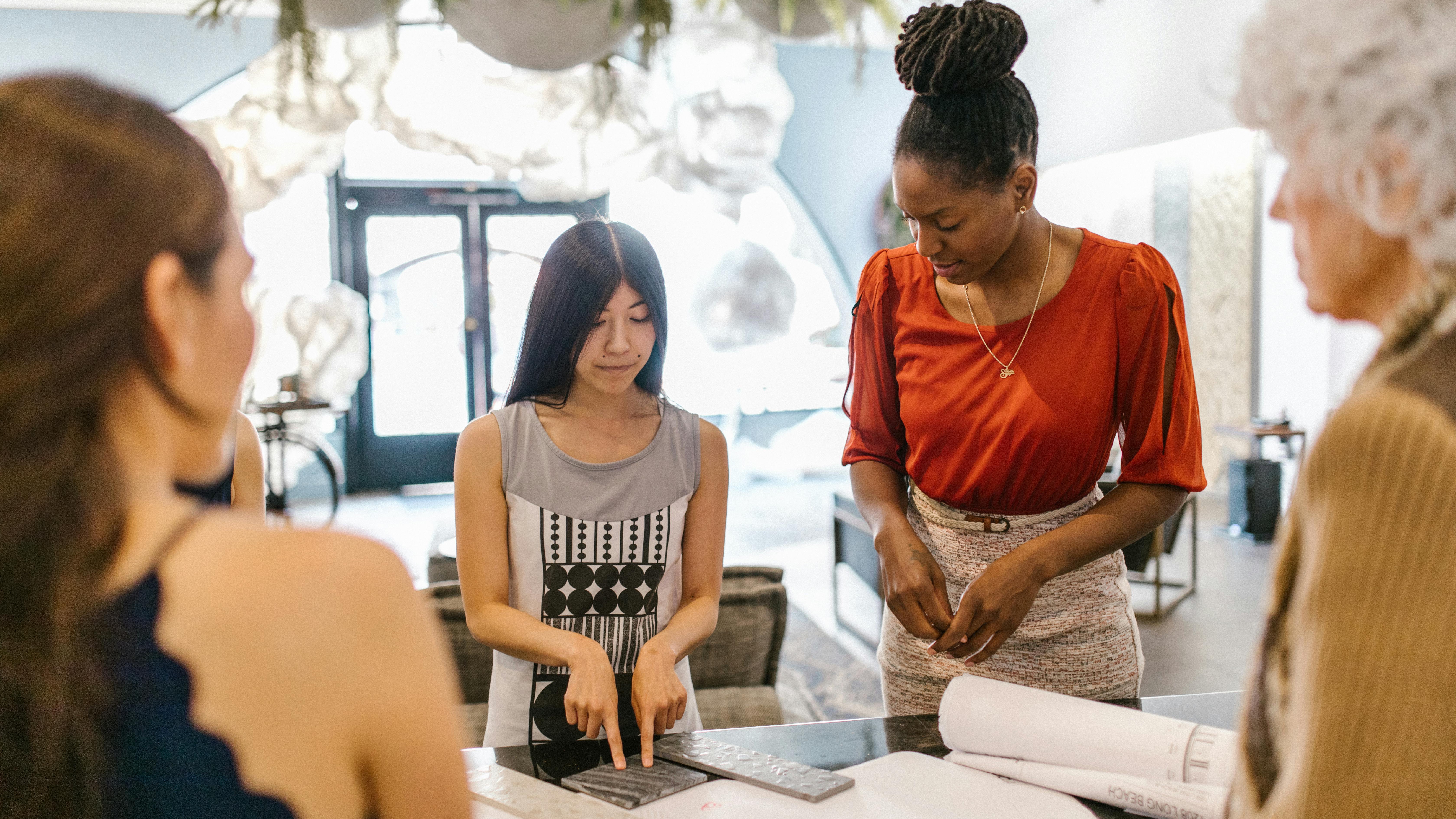 Leadership development through ERG event, businessmen handshake, office setting.