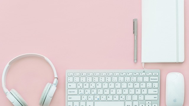 Light green tiles in modern bathroom enhance space, bright lighting.