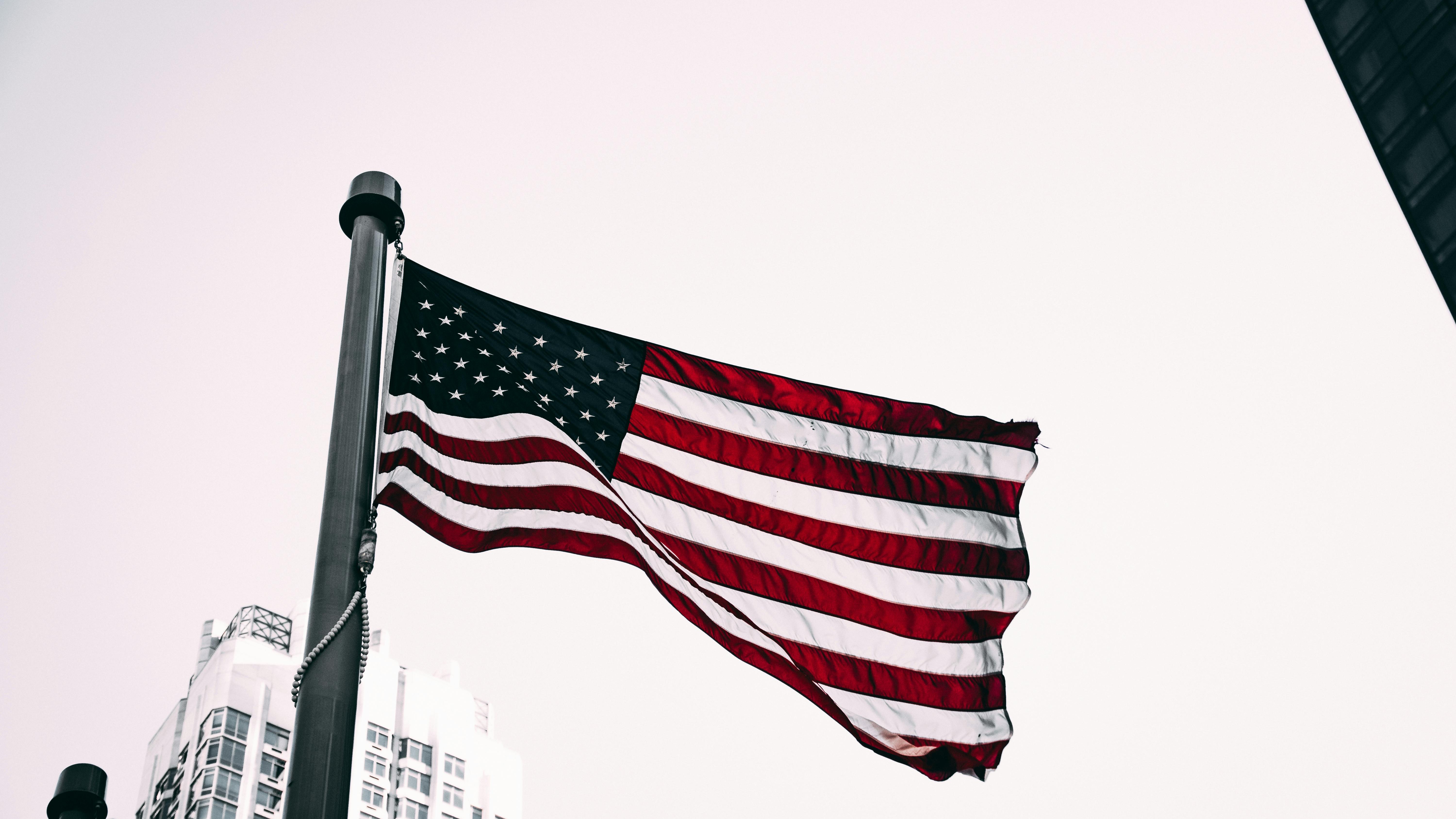 FMLA travel time thought with government building displaying American flag.
