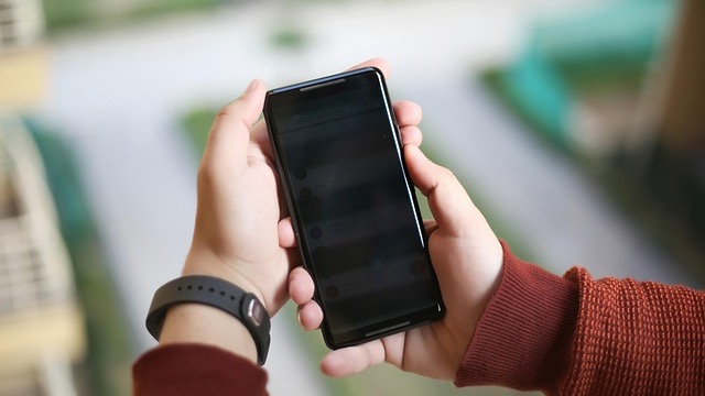 Futuristic hand with AI text, digital technology interface