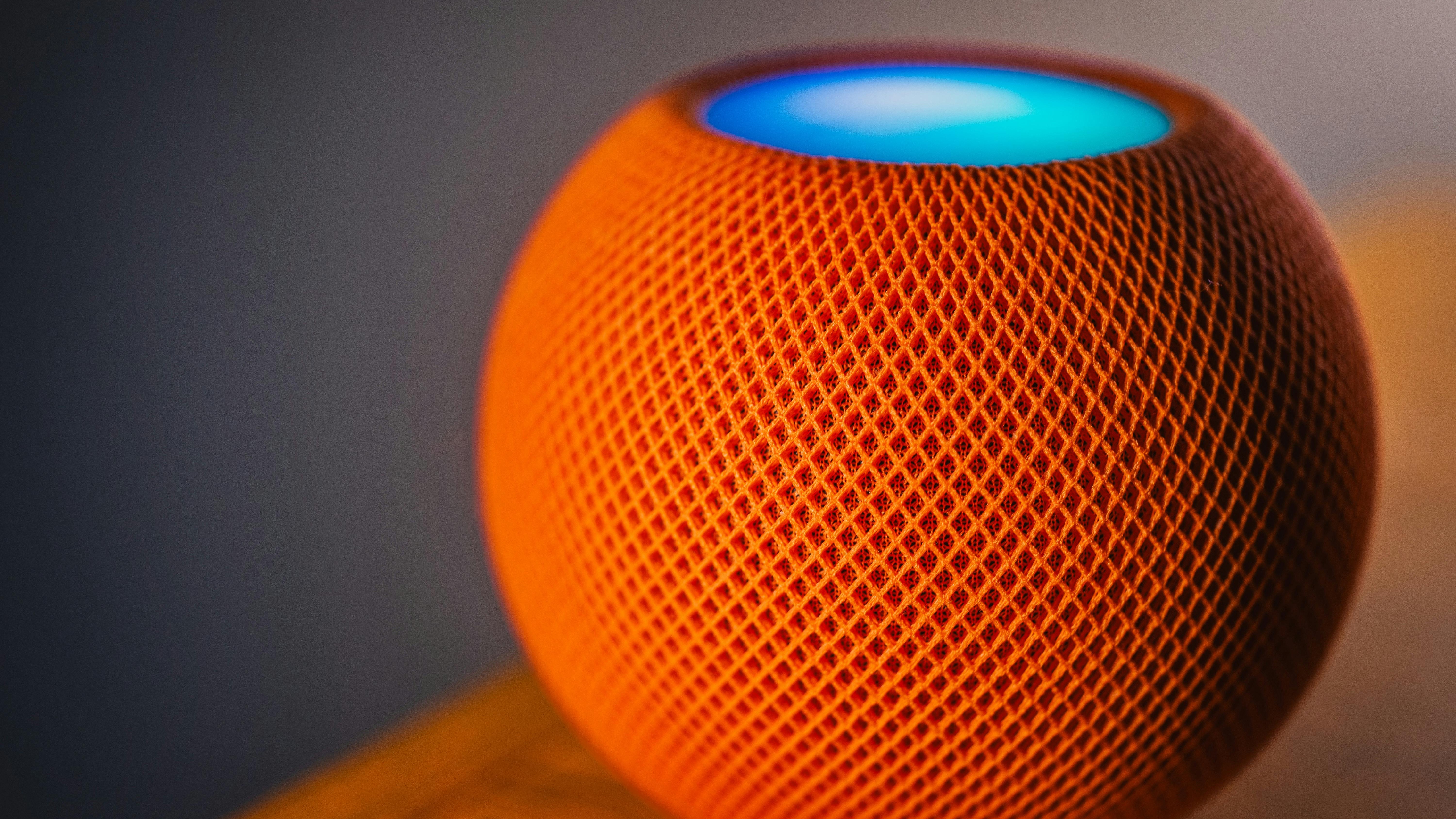 Netgear Orbi 370 mesh systems in a colorful geometric setting.