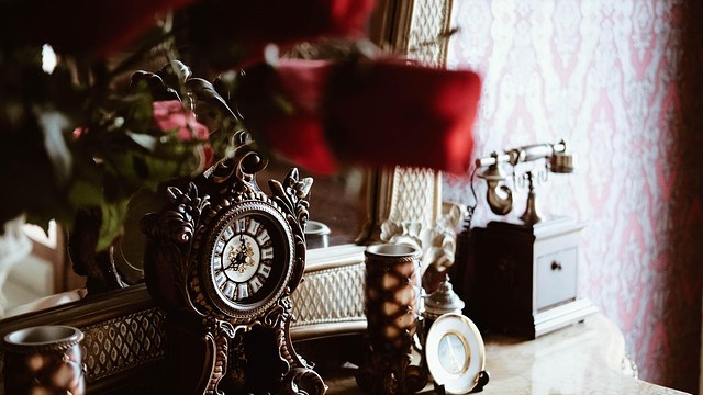 Elegant vintage hallway featuring ornate staircase and stained glass.