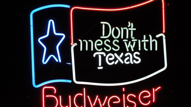 San Antonio restaurants on vibrant River Walk with lights.