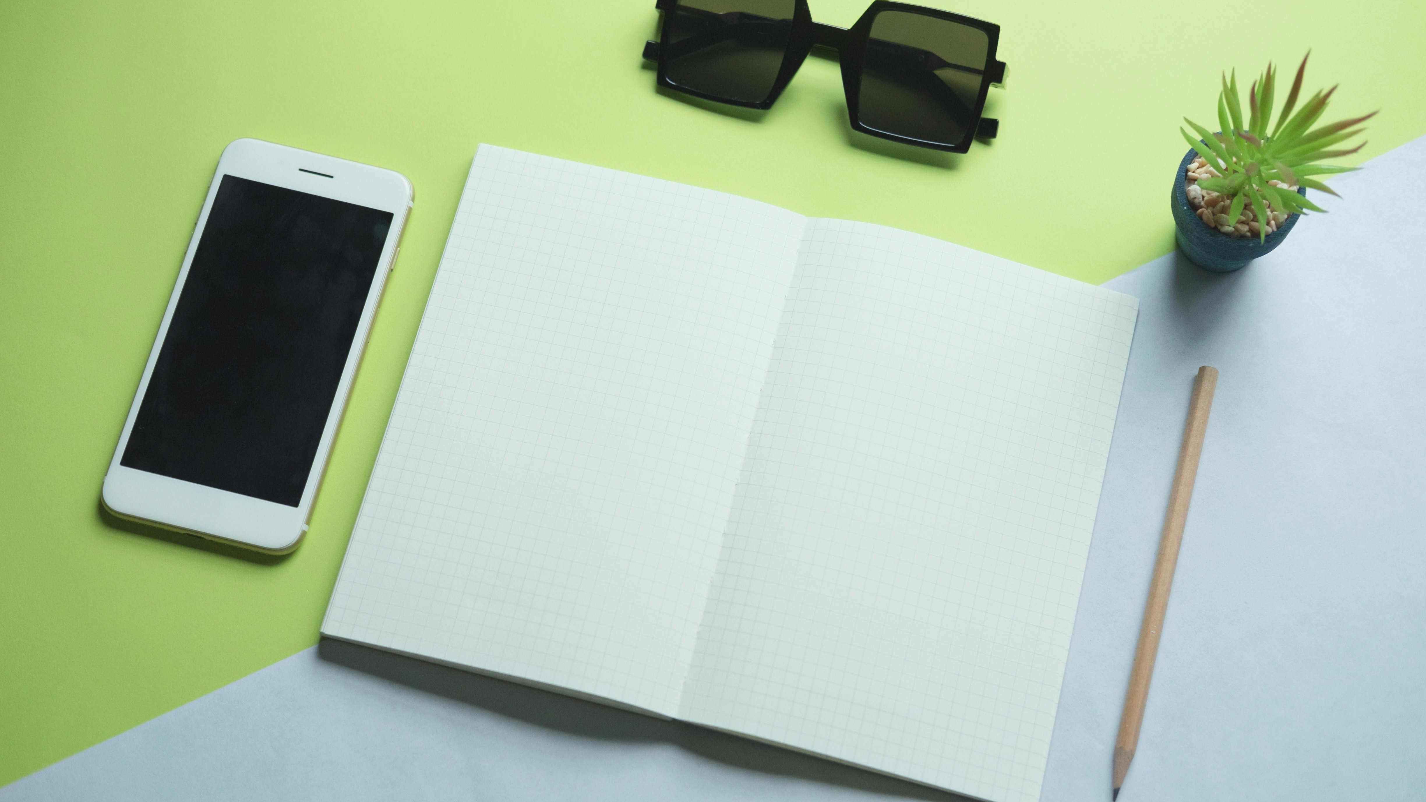 Elegant green home decor including pillows, lamp, and more.