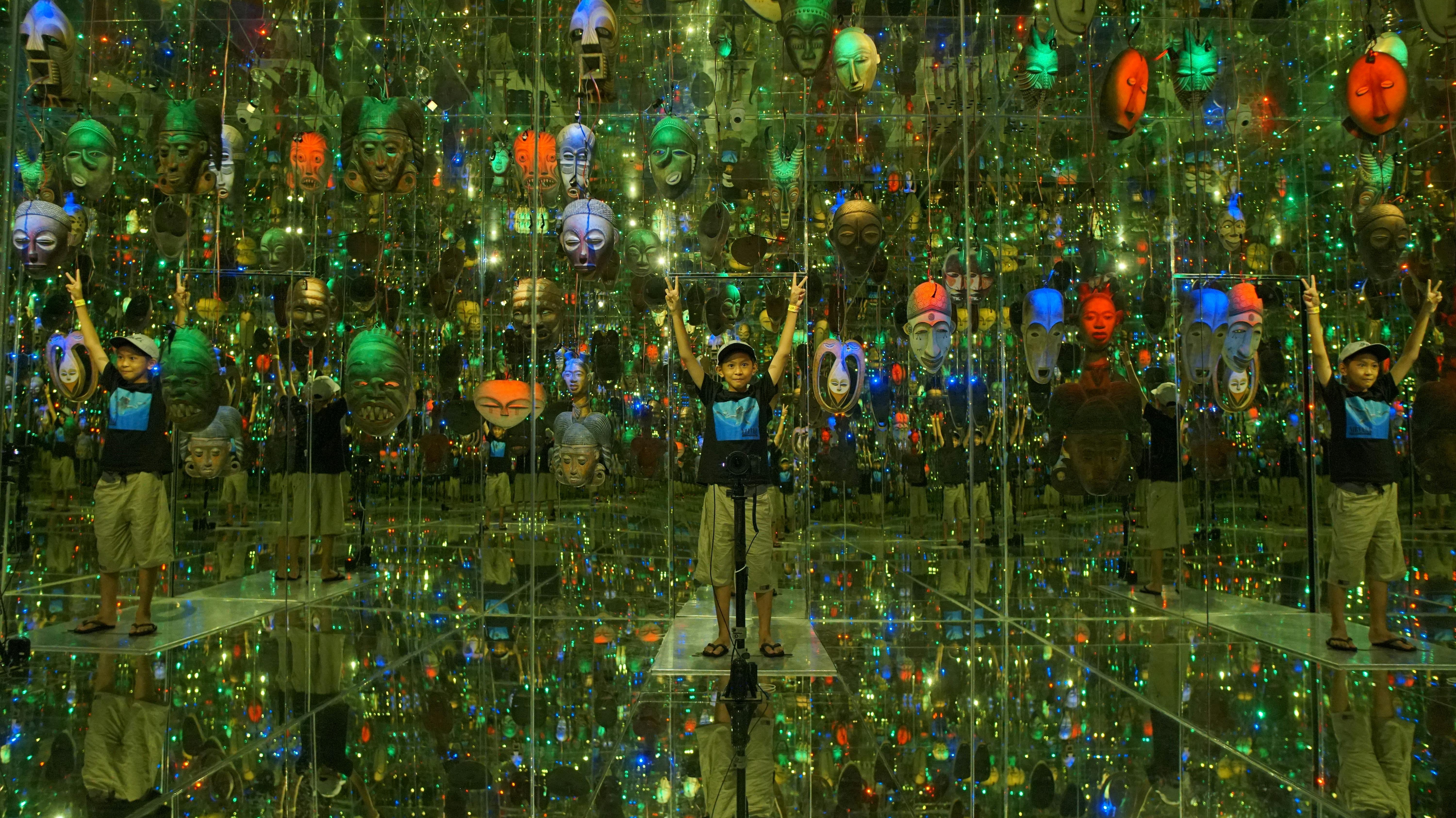 Omaha urban museum with geometric design near river, vibrant cityscape.