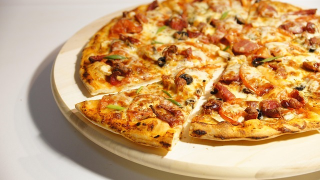 Blended family meal with pizza and laughter.