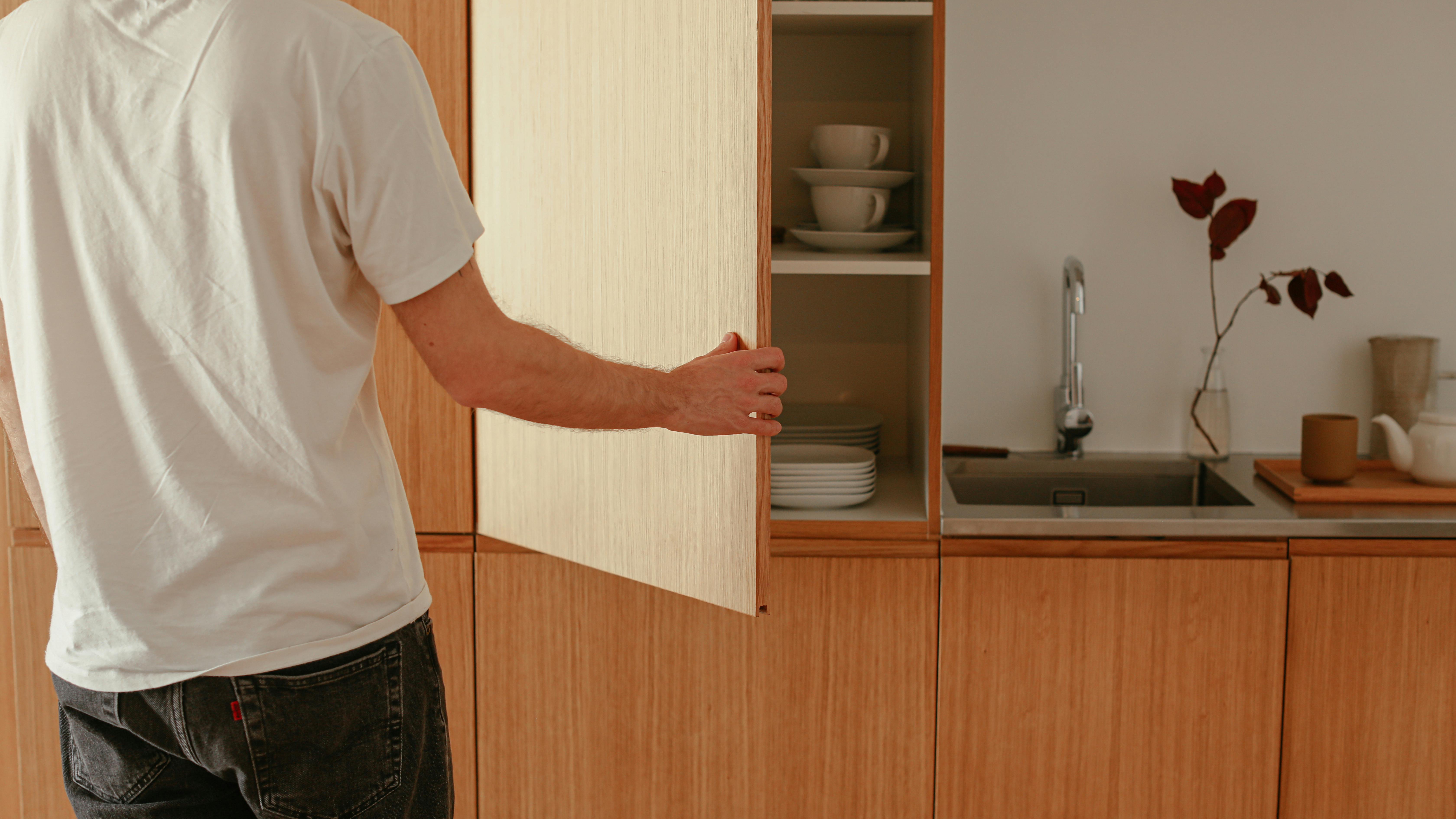 White DIY corner wall cabinet with open door