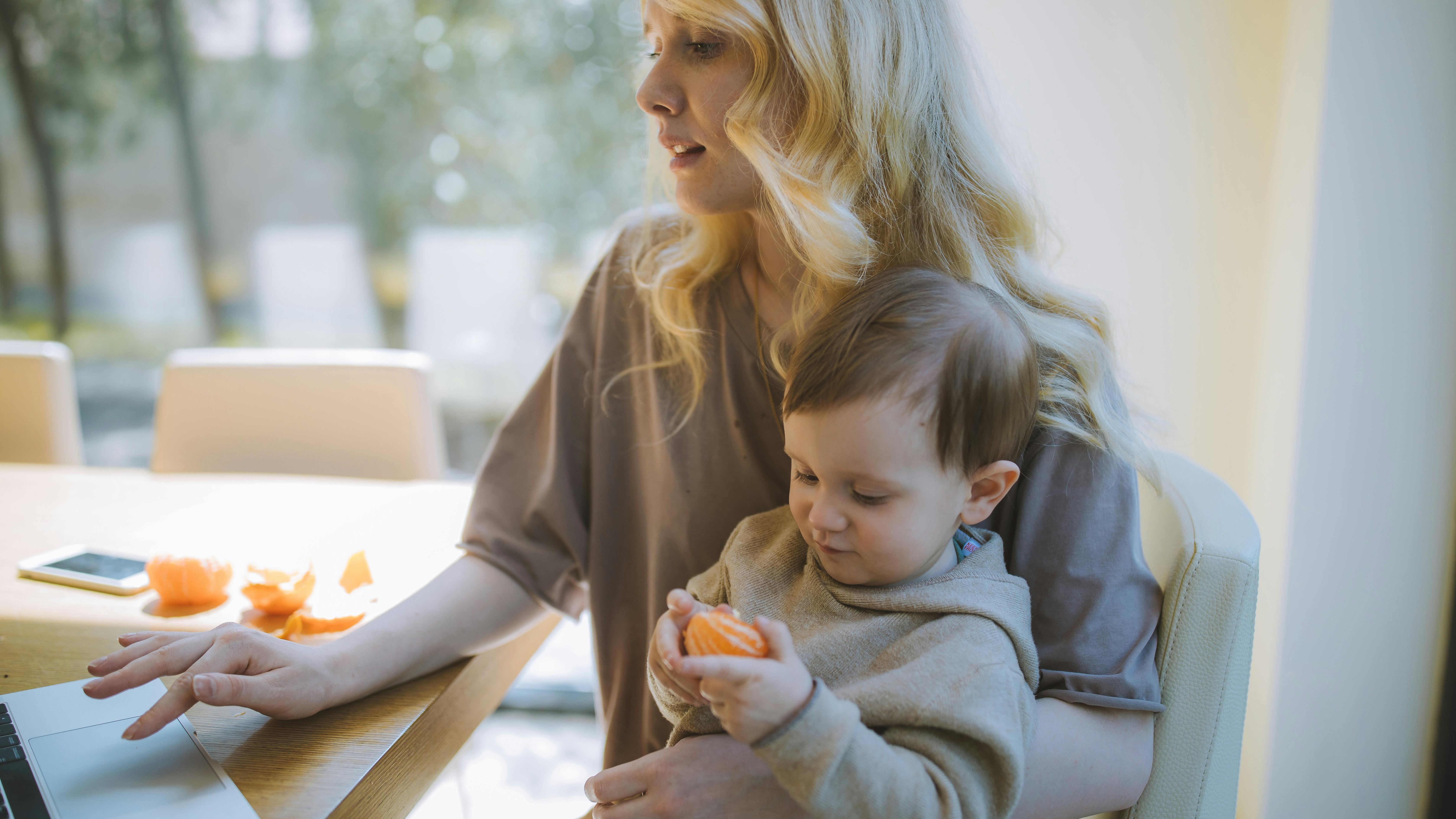 Mom and child together in a vibrant garden for self-care without a babysitter