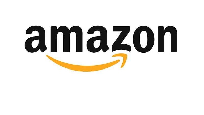 Amazon packages being moved near USPS truck, delivery scene.