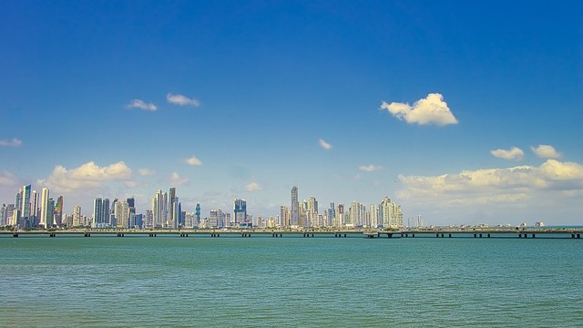 Panama City aerial view with skyscrapers and ocean for Panama Golden Visa program 2026.