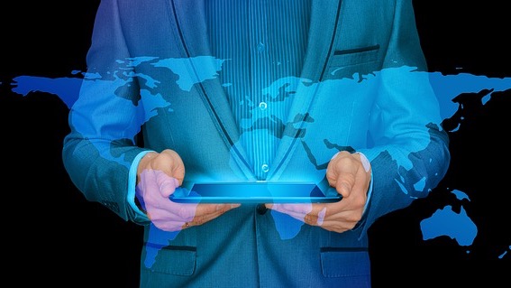 Futuristic robotic hand holding Earth model illustrating AI world models.