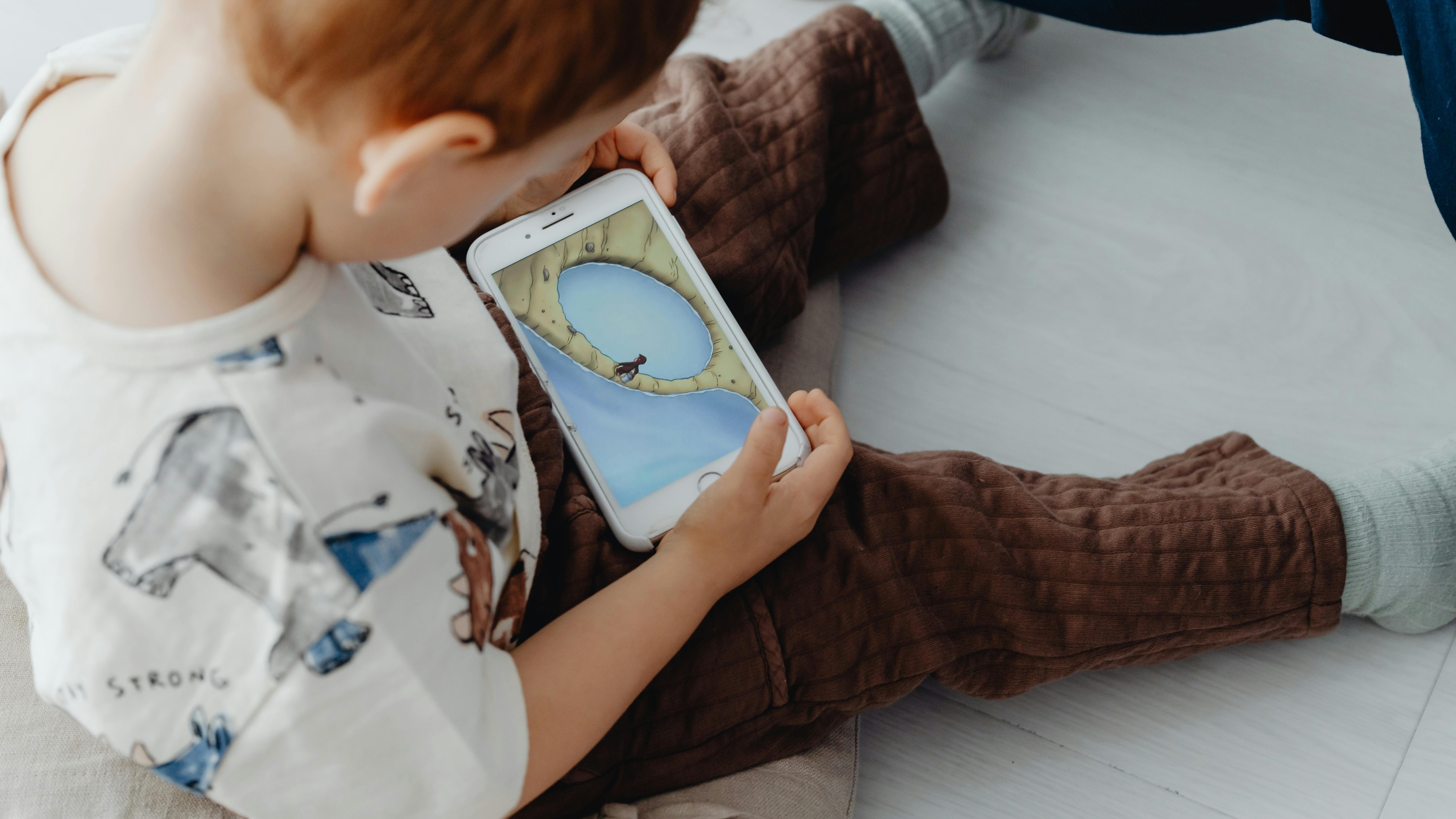 Joyful play in colorful ball pit promoting Blippi's Curiosity Club app.