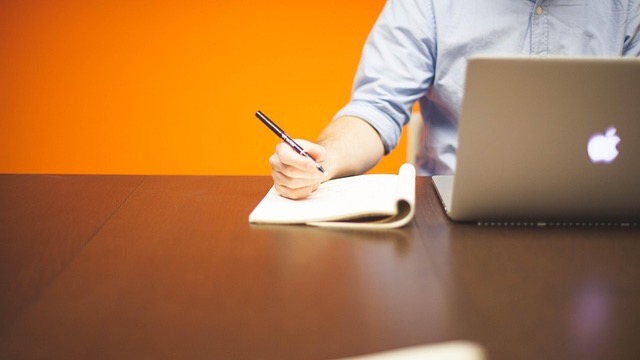 Thoughtful man discussing AI's impact on jobs in modern office.