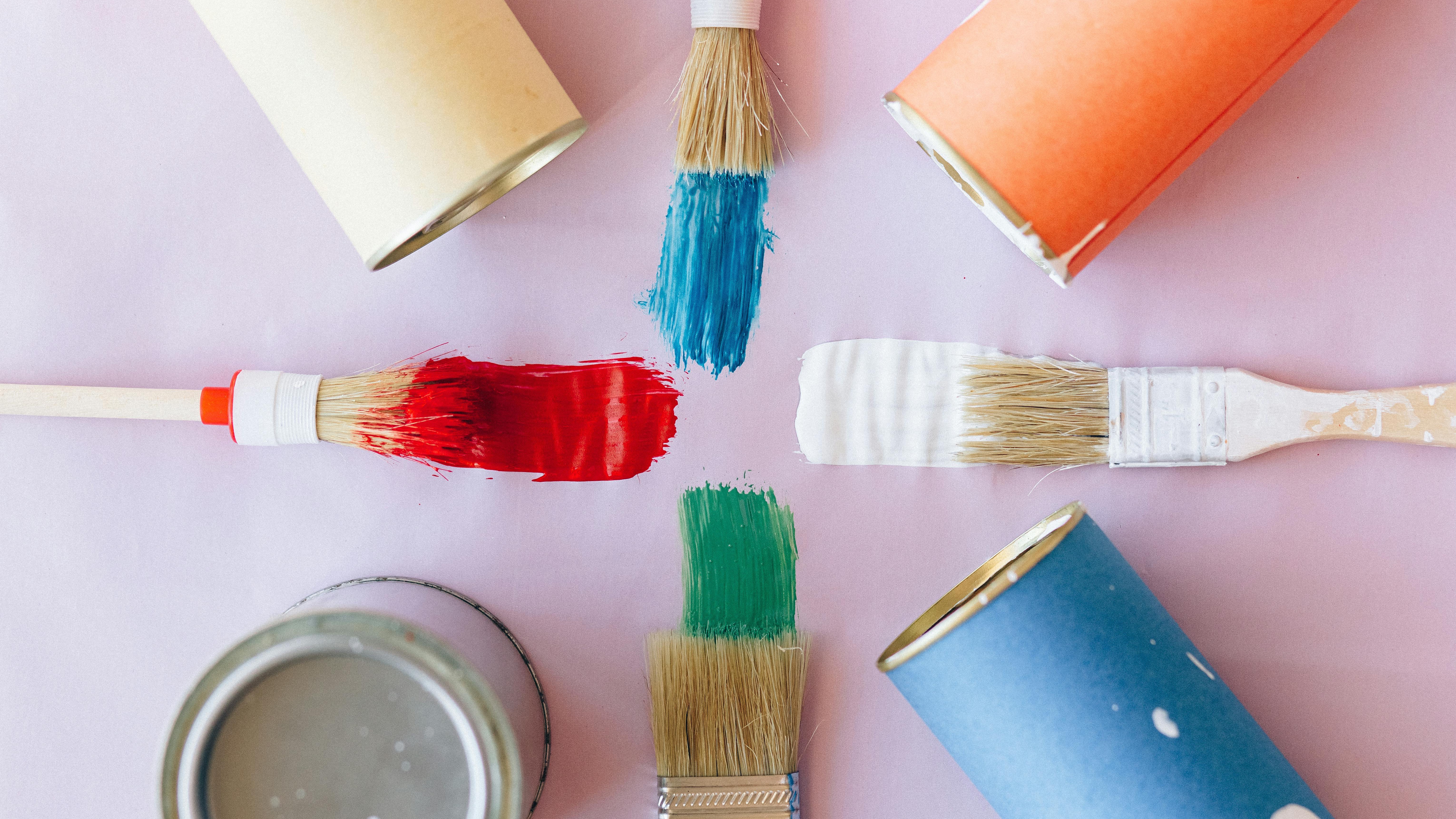 DIY shadow box with memorabilia and a vase on a wooden surface.