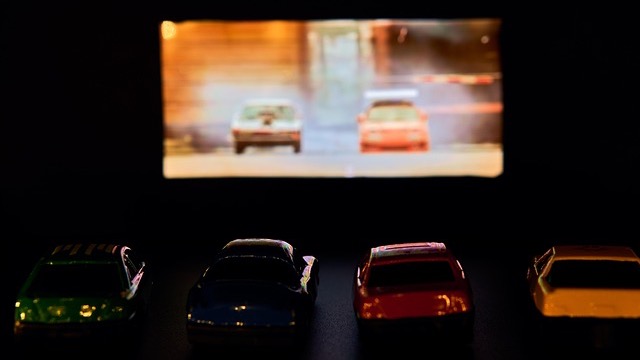 Omaha drive-in season: Man enjoying movie at outdoor theater