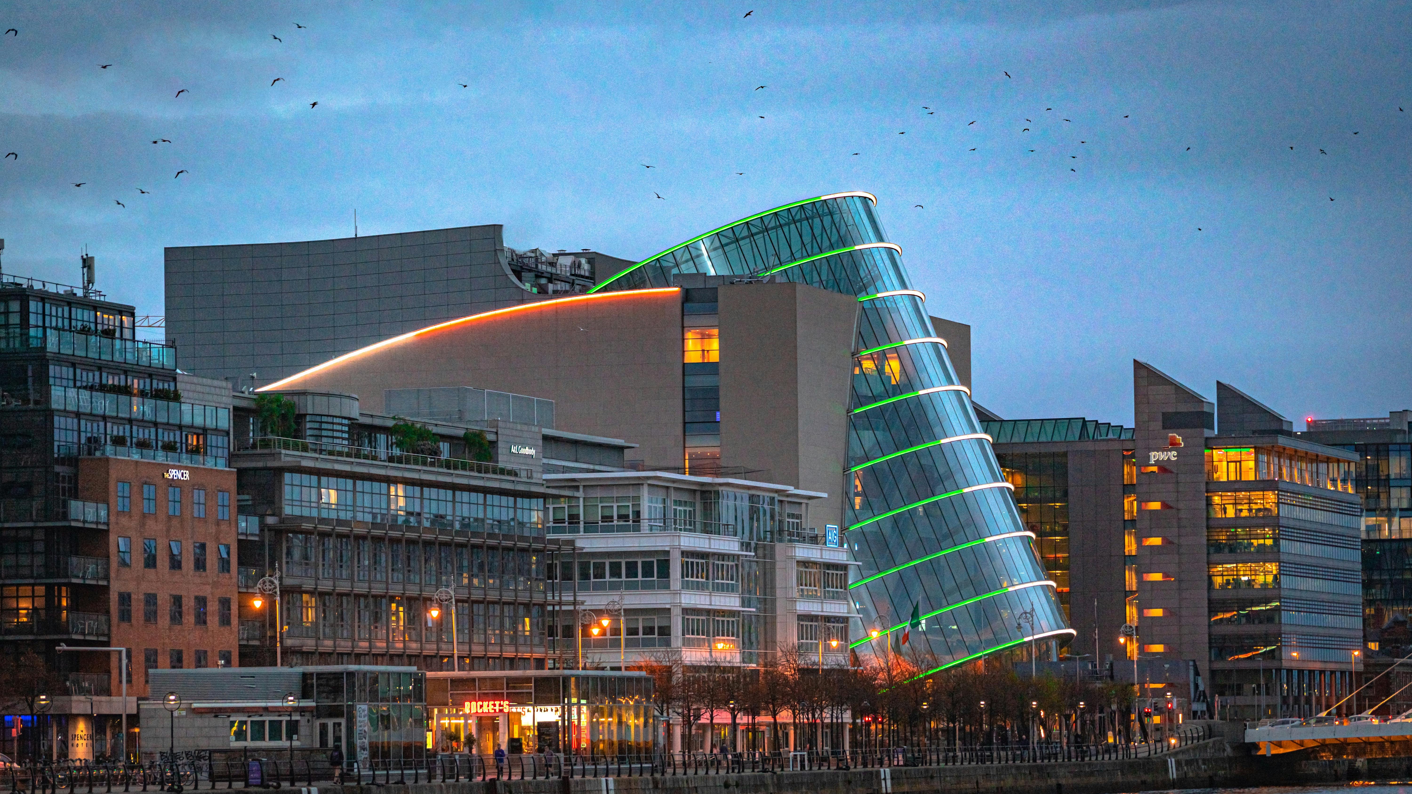 Two professional men discussing AI as a force for good at the World Economic Forum.