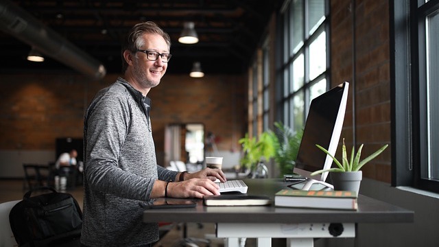 AI ethics in the workplace: professionals analyzing data in an office.