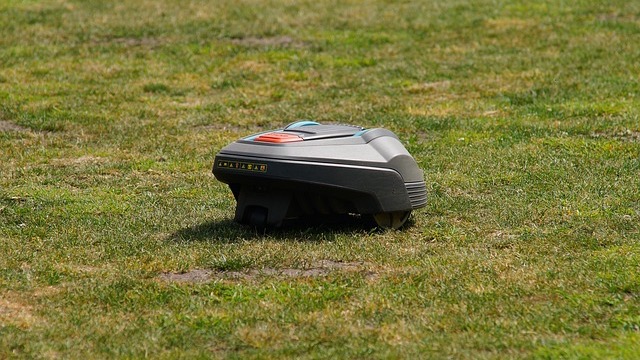 Segway Navimow robot lawn mowers on display with artificial turf.