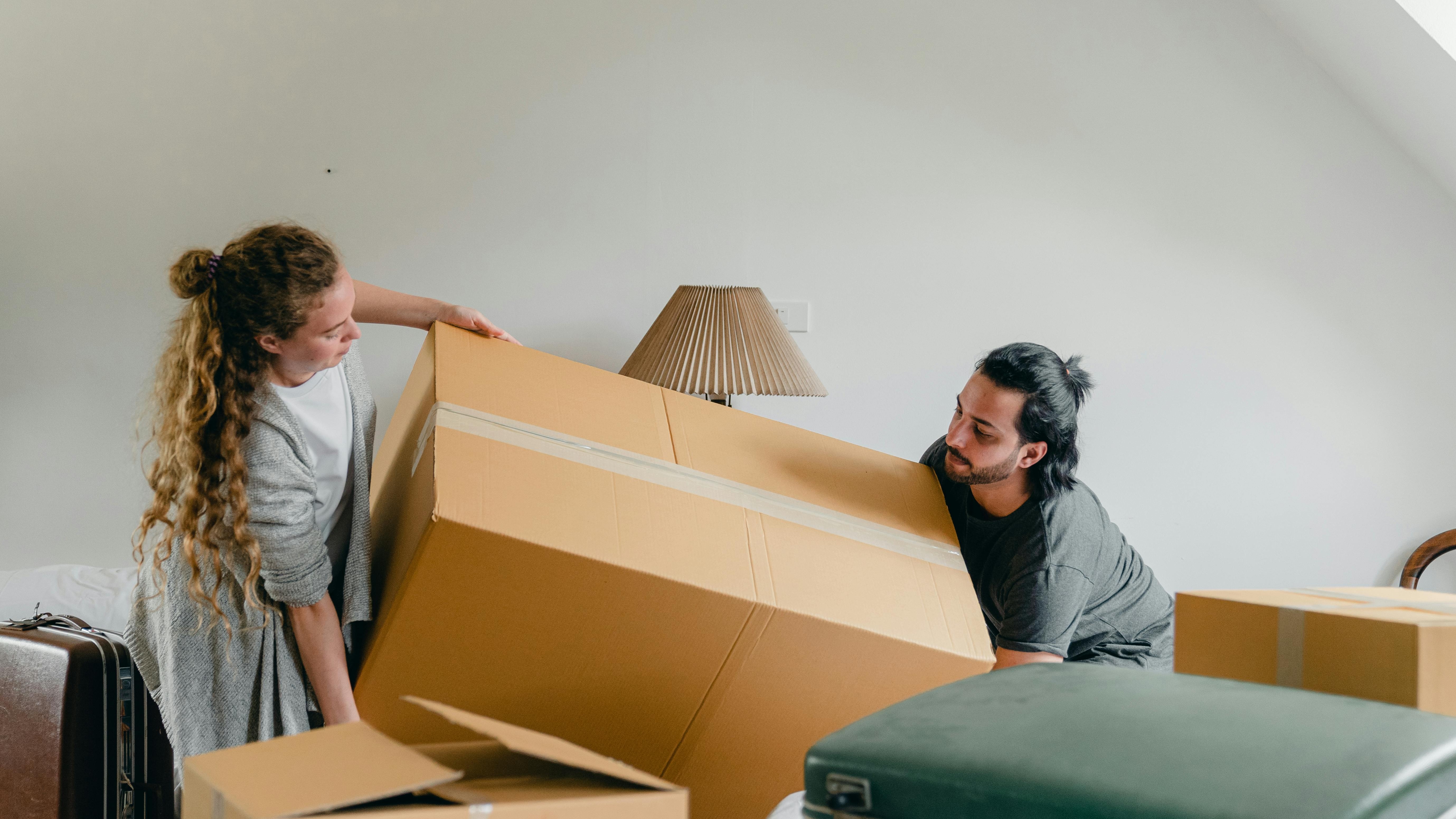 Professional movers from best long-distance moving companies loading a truck.