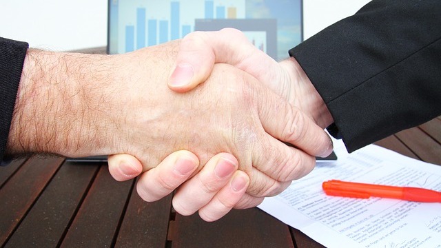VH-92A Presidential Helicopter in hangar with American flag.