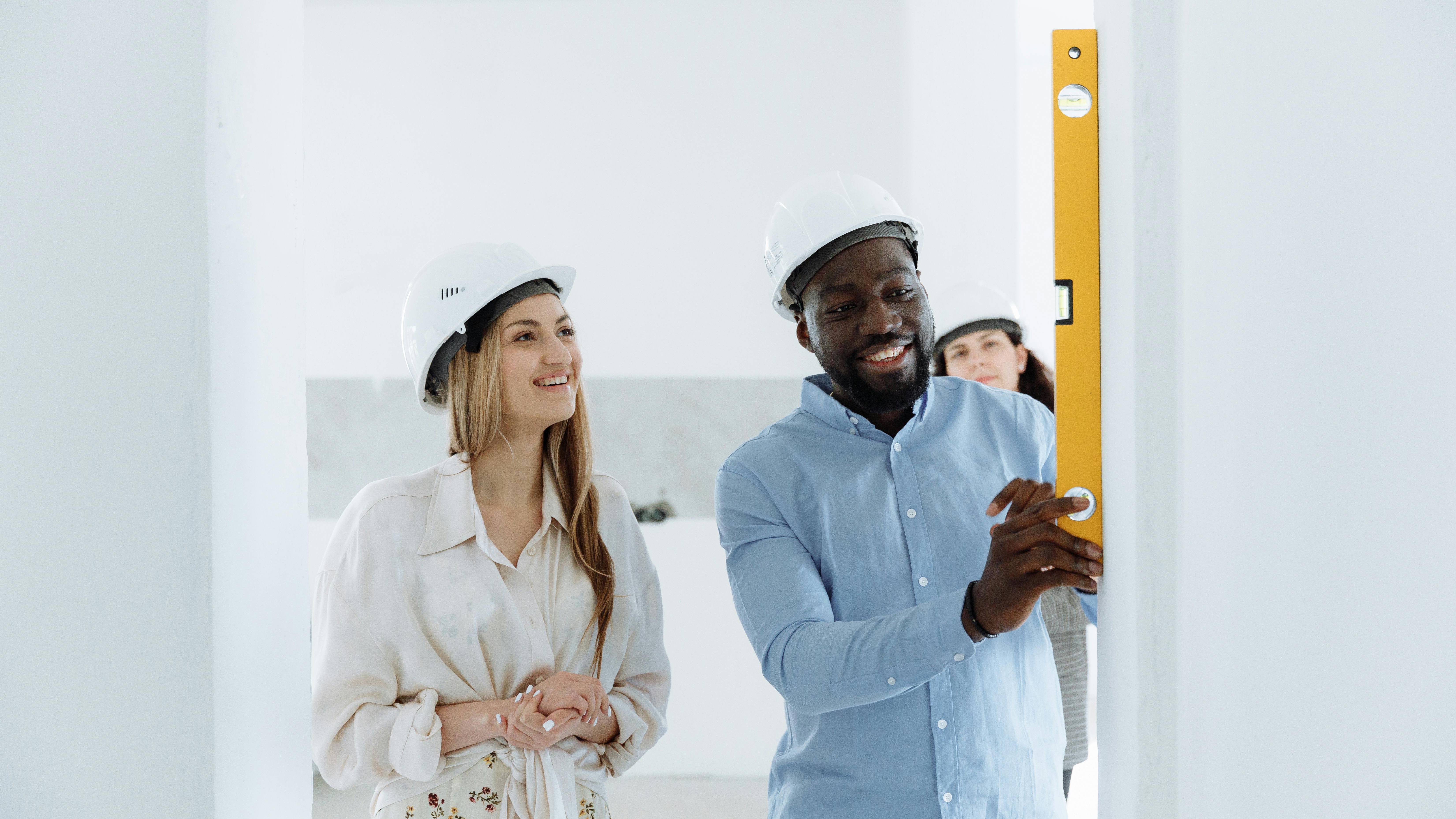 New home construction in Omaha showing worker on roof.