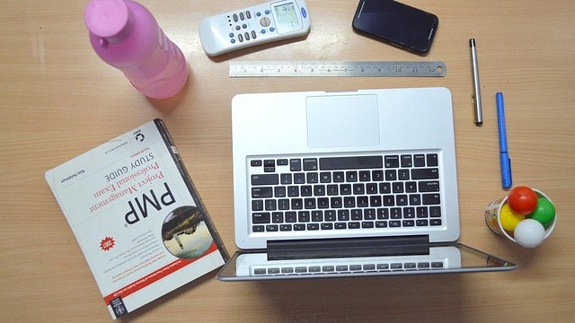 Neat desk with various mats for remote work, approved setup.