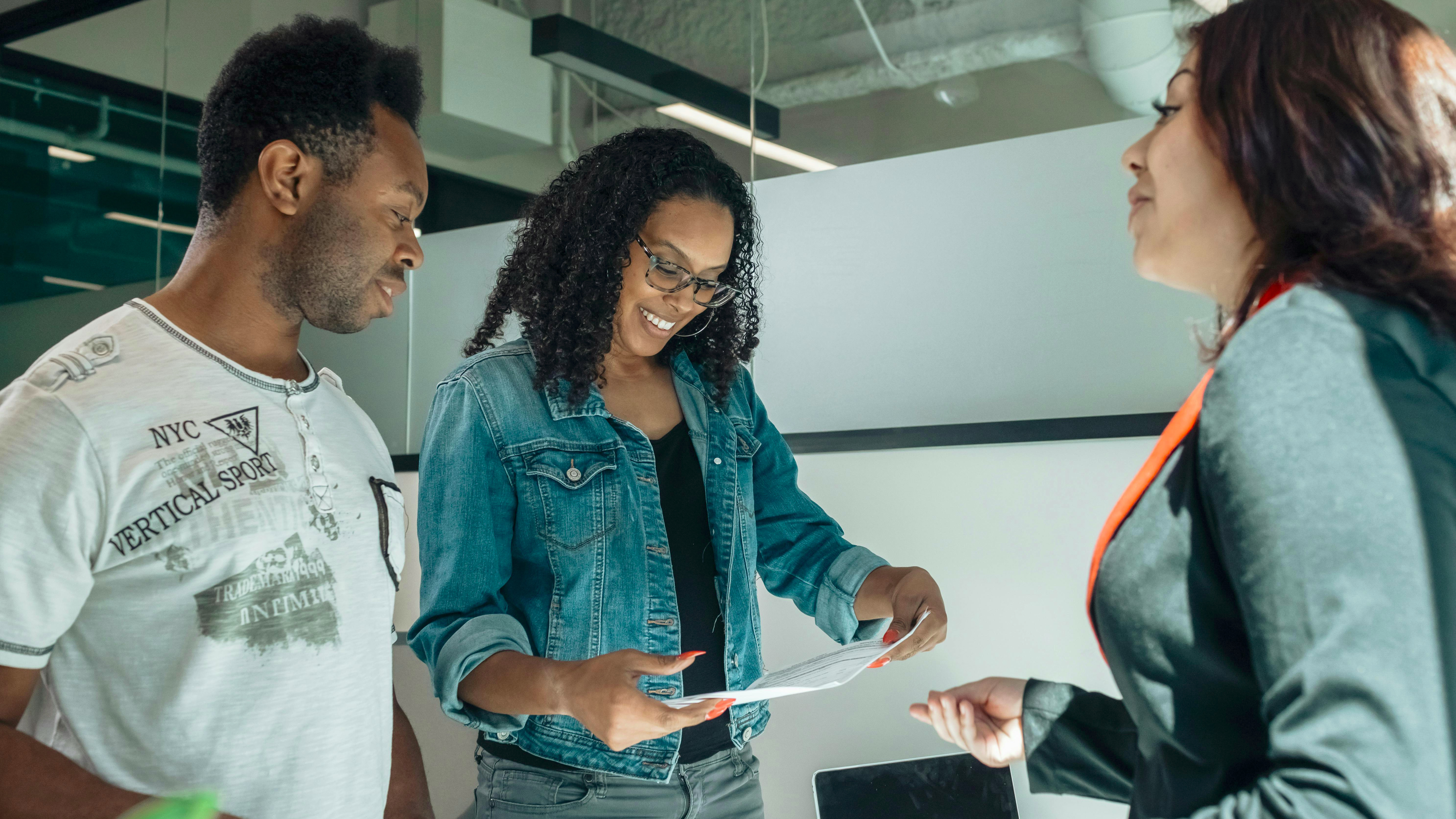 Elegant room with ornate decor and a speaker at a podium.