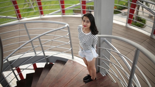 Cheerful teen enjoying sparklers, a fun and safe New Year's Eve idea.