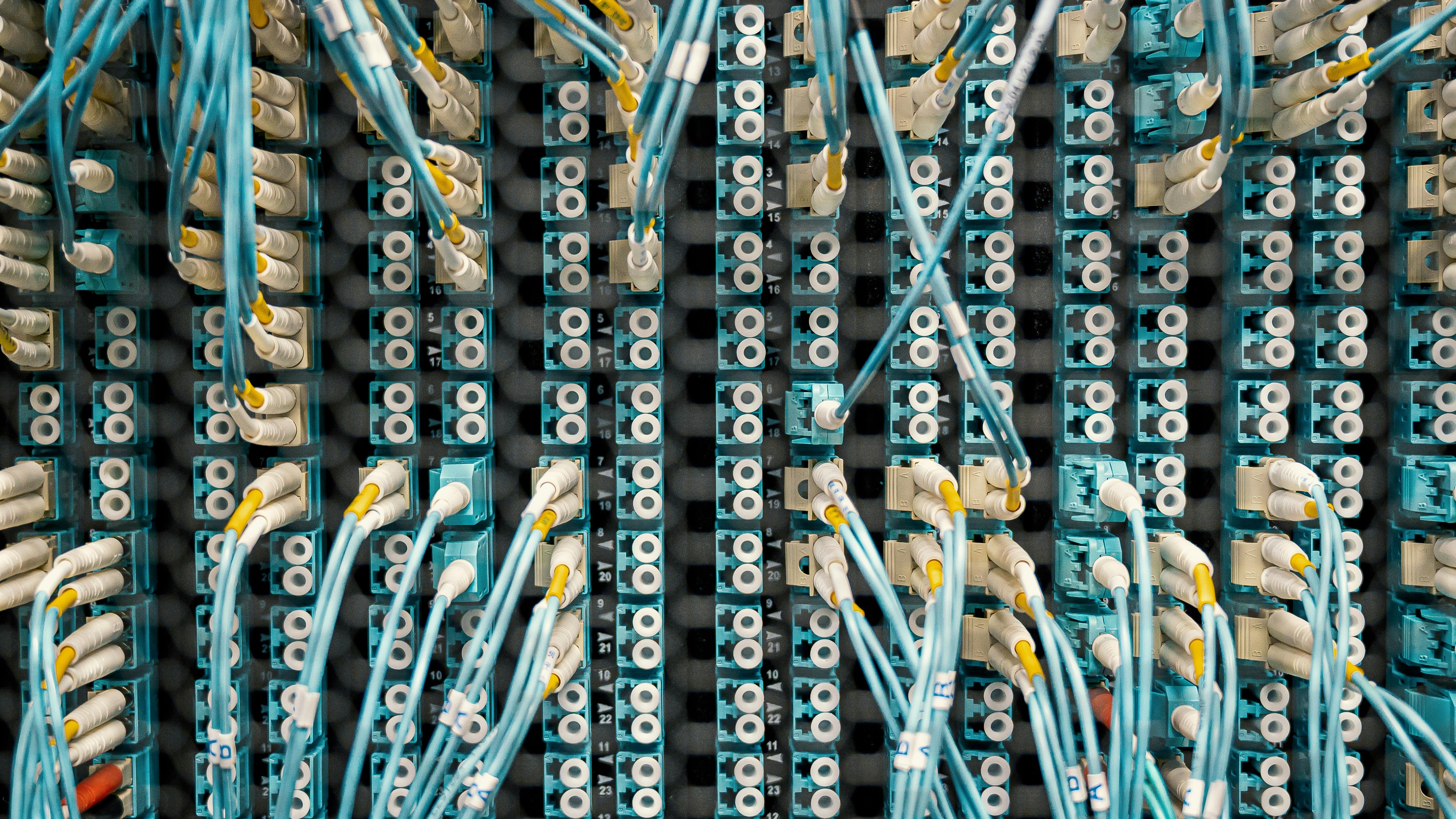 Frustrated man facing network issues in a server room.