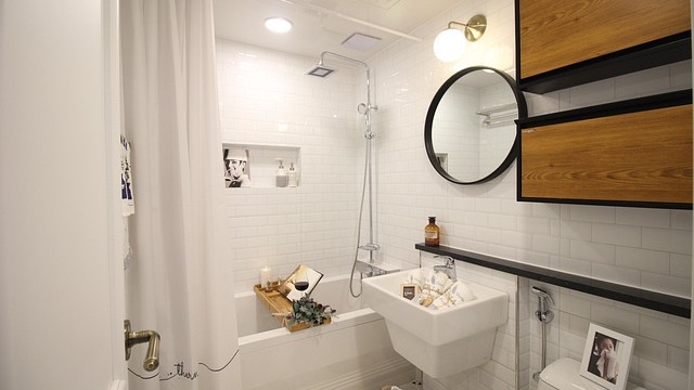 Elegant bathroom upgrades for remote workers with modern design and skylight.