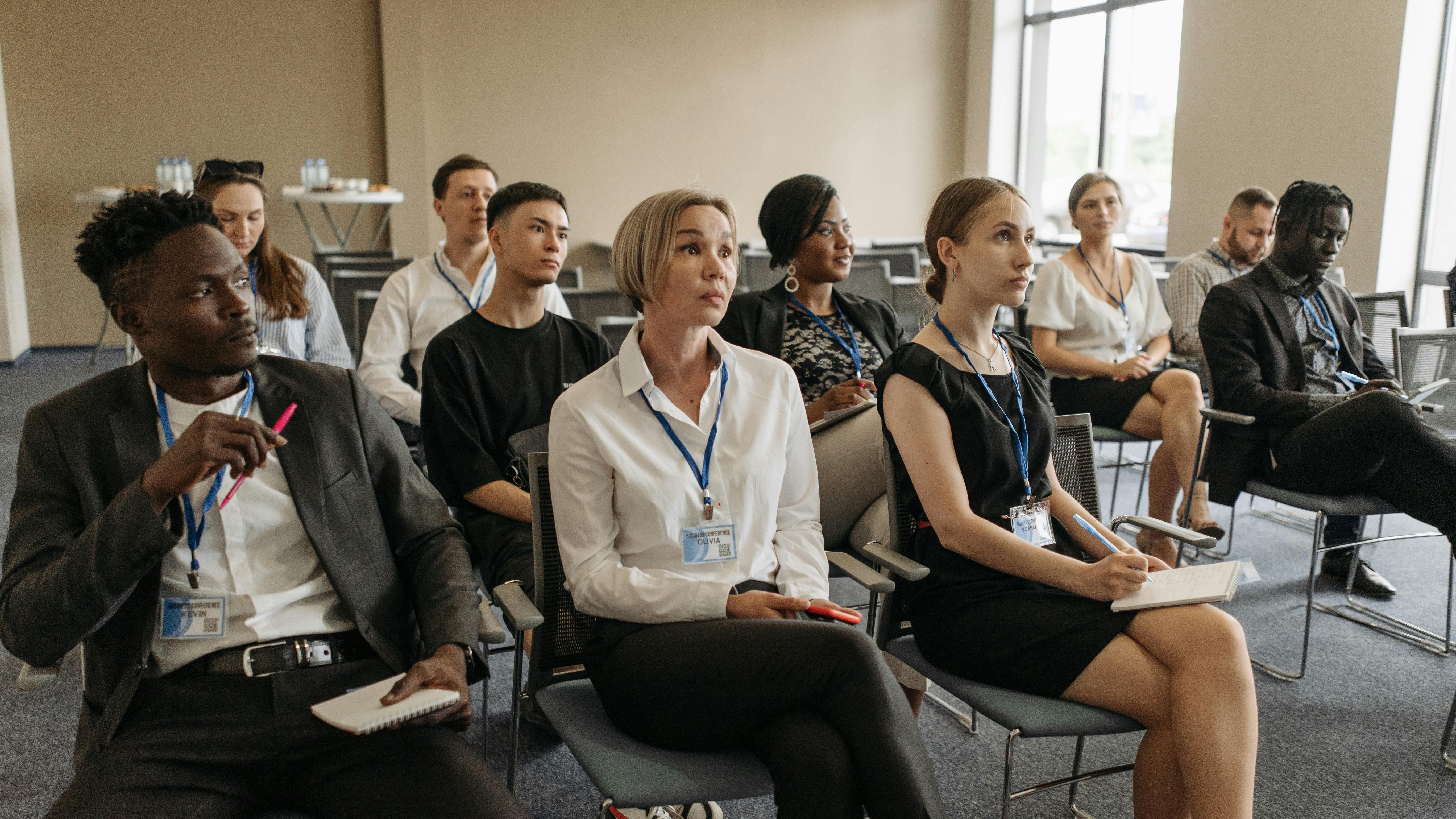 Diverse team celebrating inclusive workplace culture certification.