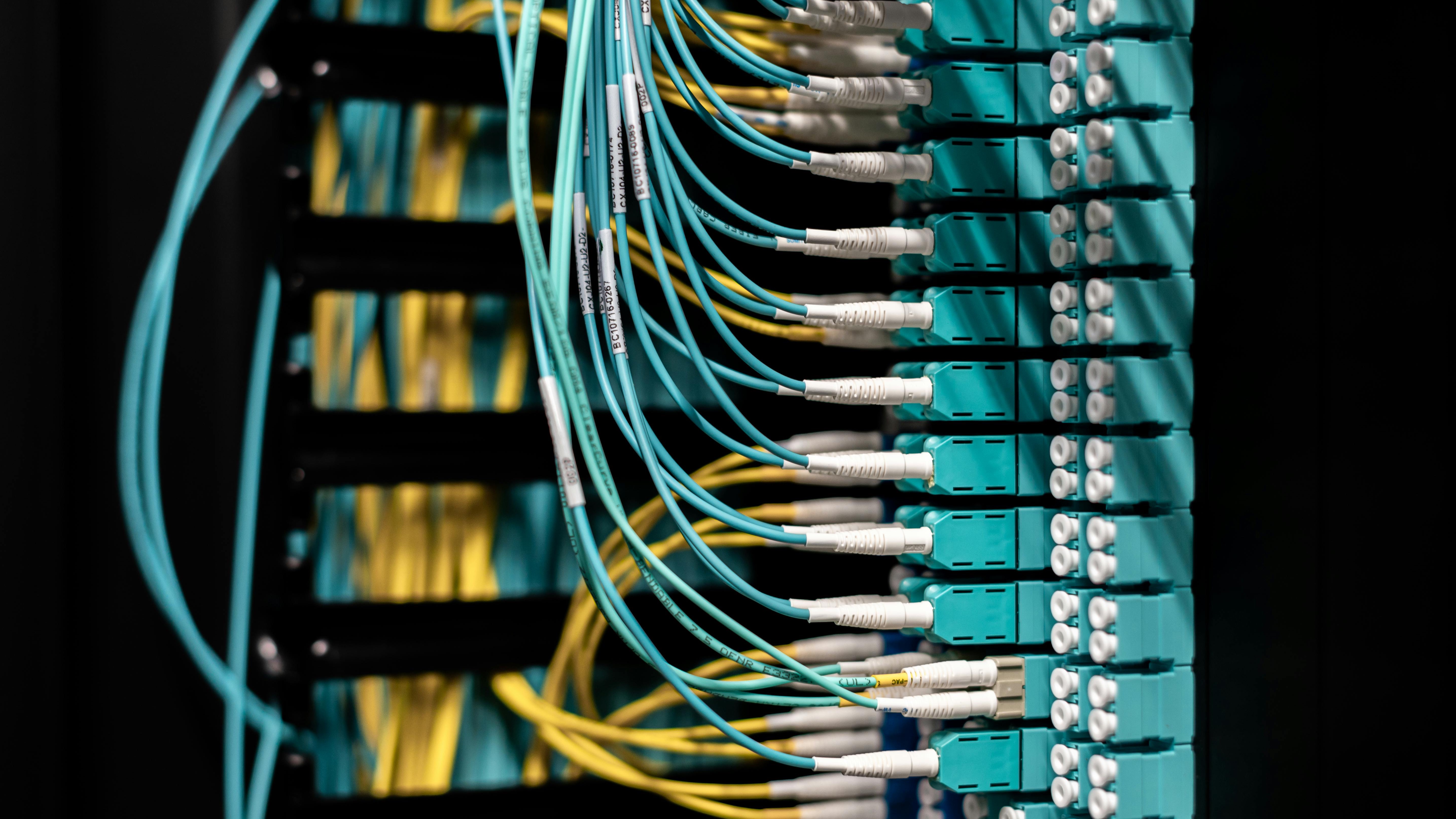 Abstract view of fiber optic cables in Oneonta glowing blue.