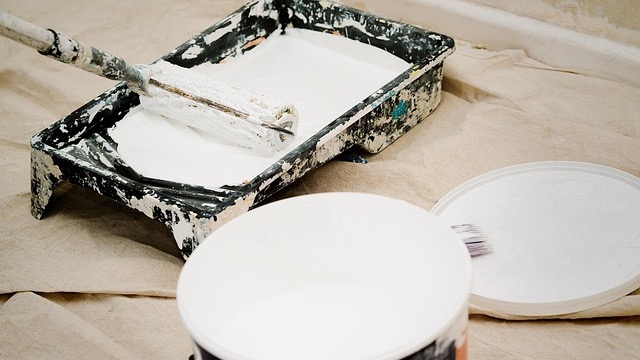 Elegant white front door with glass panels and warm lighting.