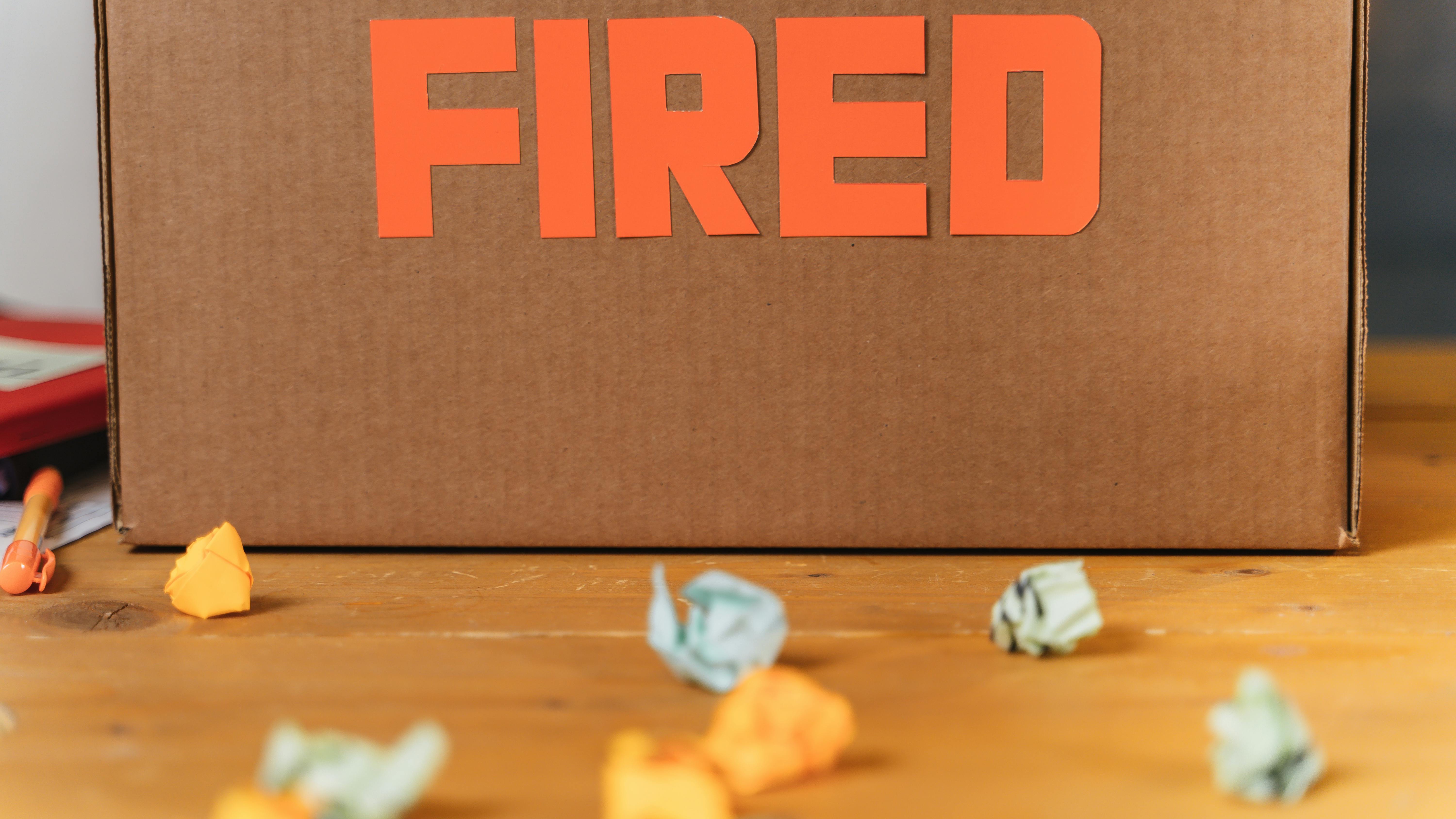 Office supplies box illustrating executive leadership in biopharma layoffs.