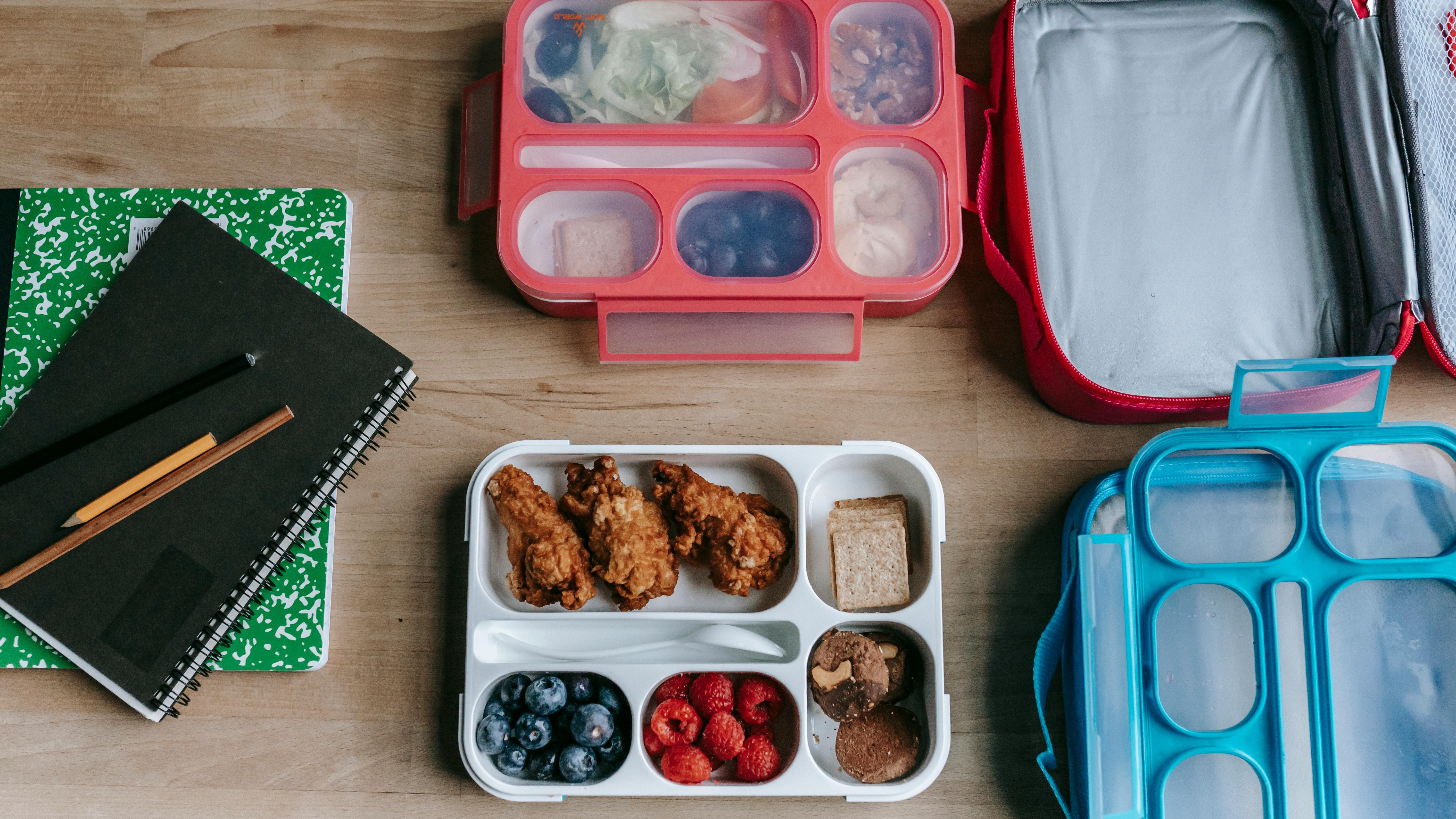 Hearty chicken noodle soup and strawberries, healthy family meals focus.