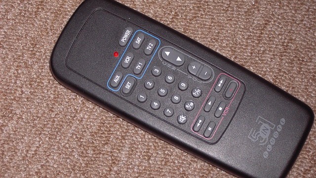 Amazon Fire TV Stick in HDMI port, close-up detail.