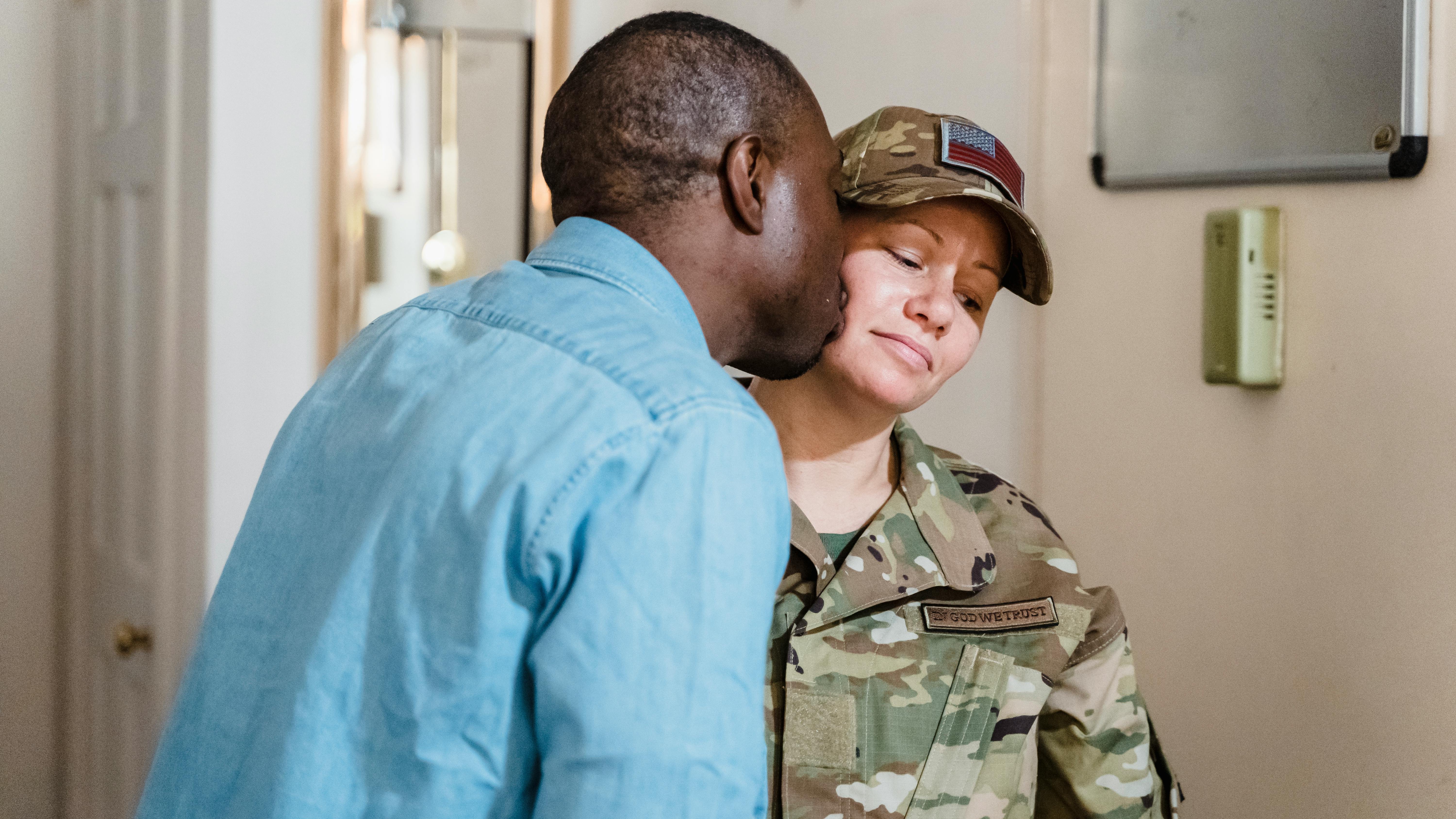 Middle-aged man moving furniture, highlighting hidden PCS costs for military families.