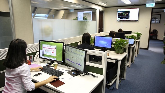 Impact of employment terminations on security clearance: man leaving office with box.