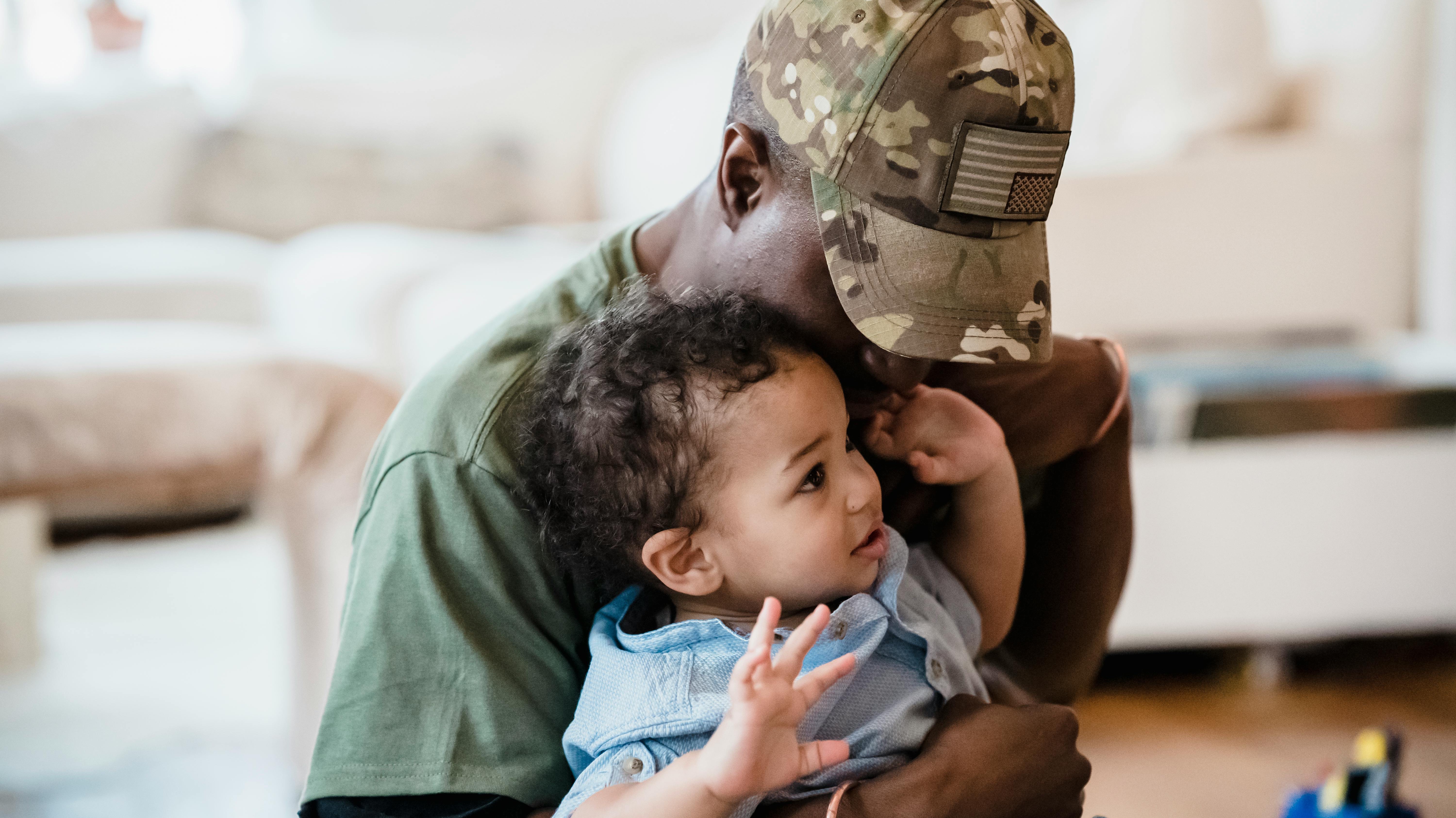 Mother nurturing newborn baby at home, symbolizing surviving the first week.