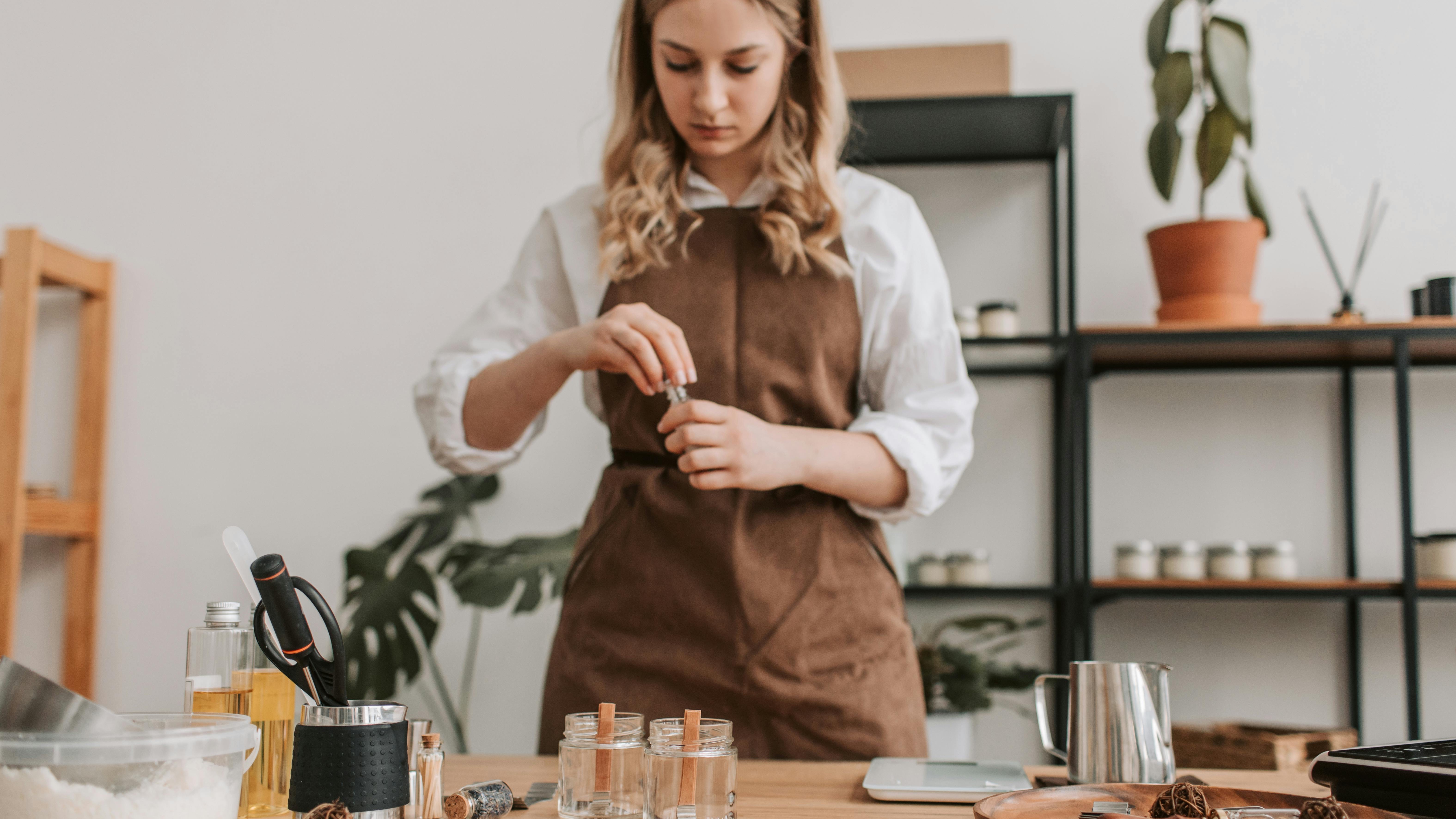 Woman at DIY Murphy desk using laptop in modern home office.