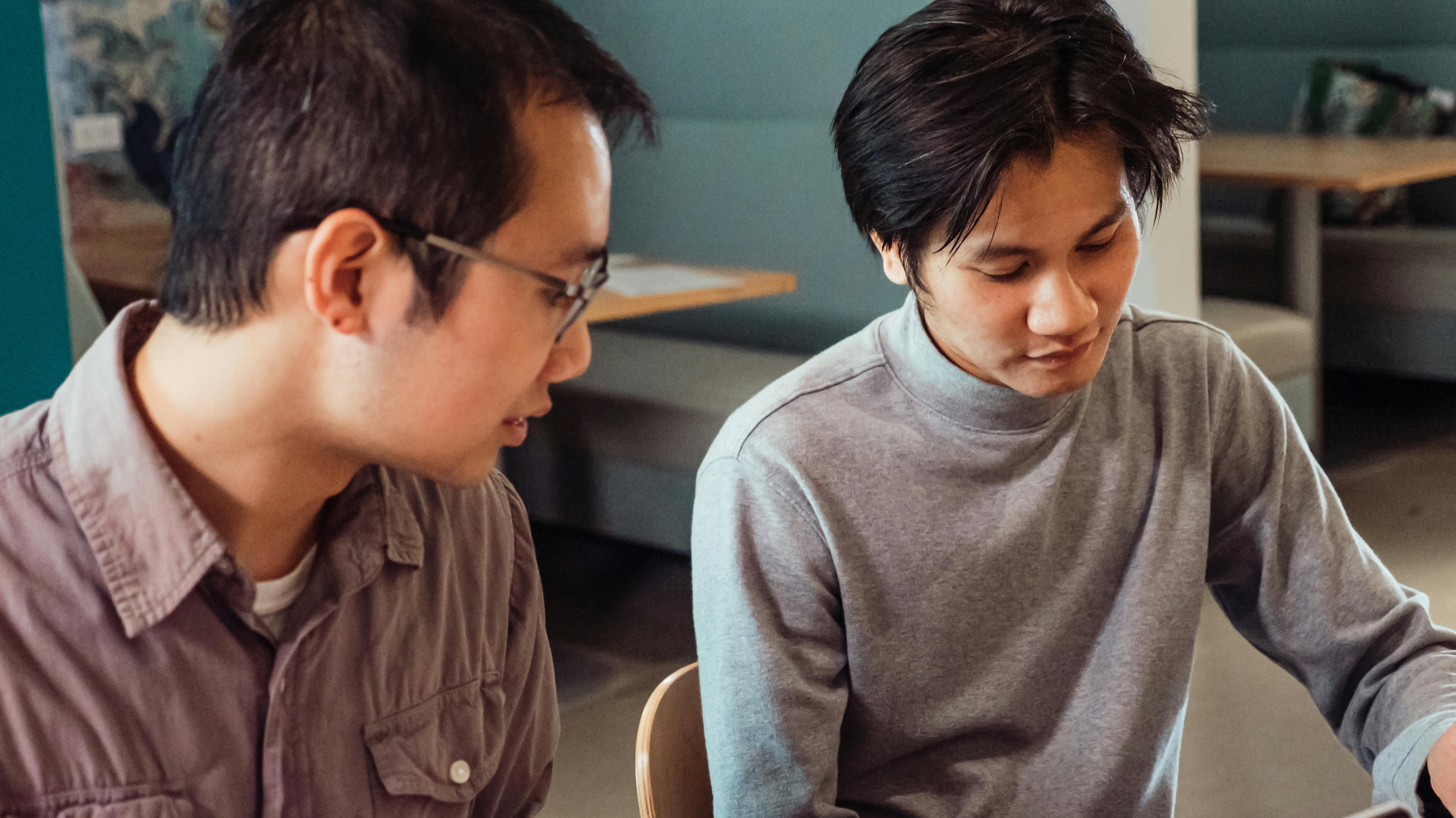 Man with red crab hat enjoys China OpenClaw craze.