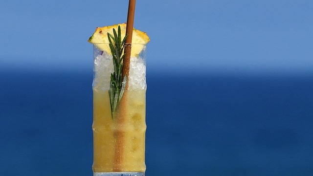 Vibrant cocktail with citrus and mint in Omaha bar setting.