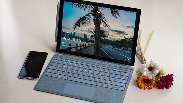 Microsoft's plan to fix Windows 11 represented by abstract geometric design.