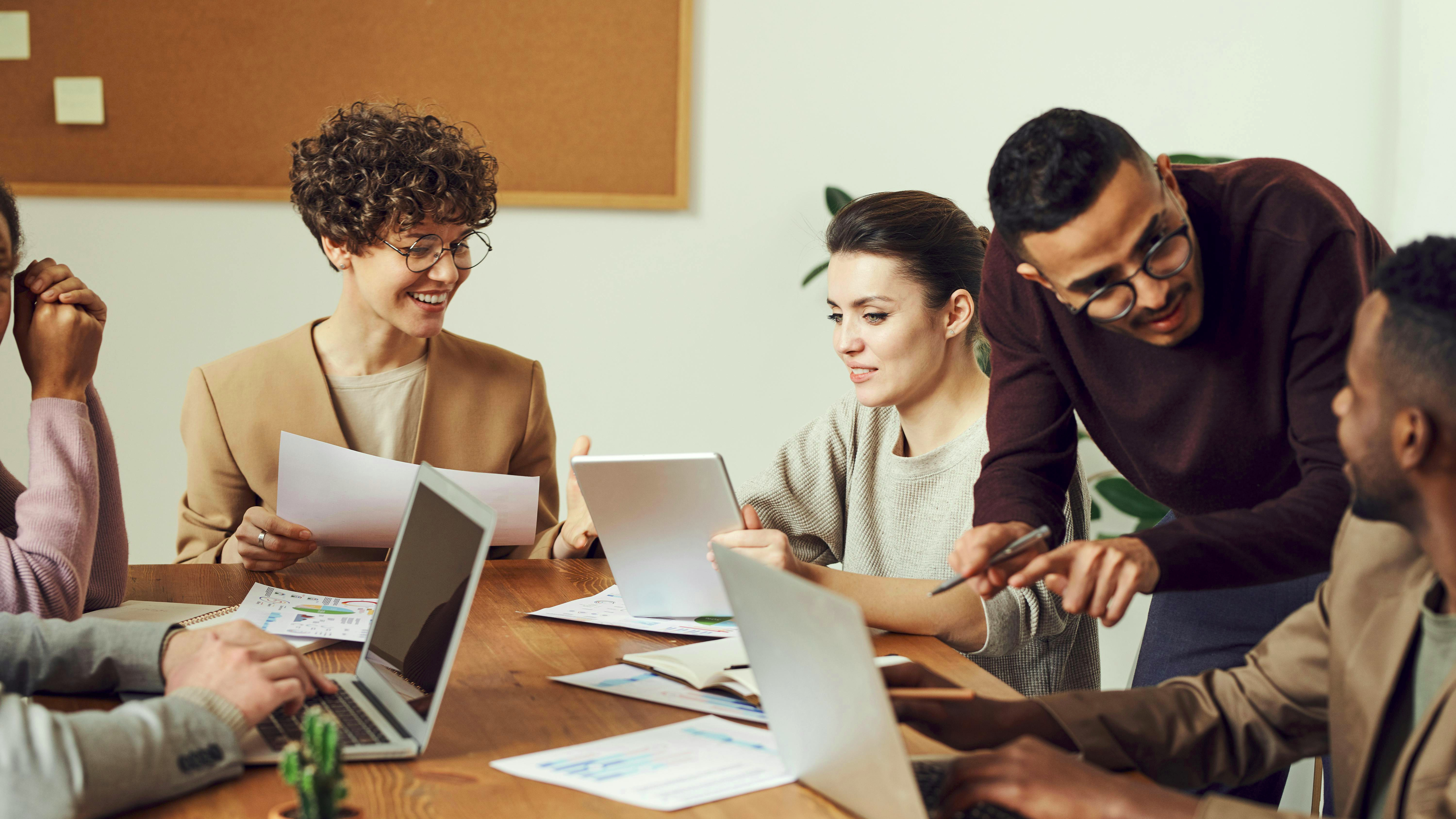 Professional woman smiling outdoors, workplace culture theme.