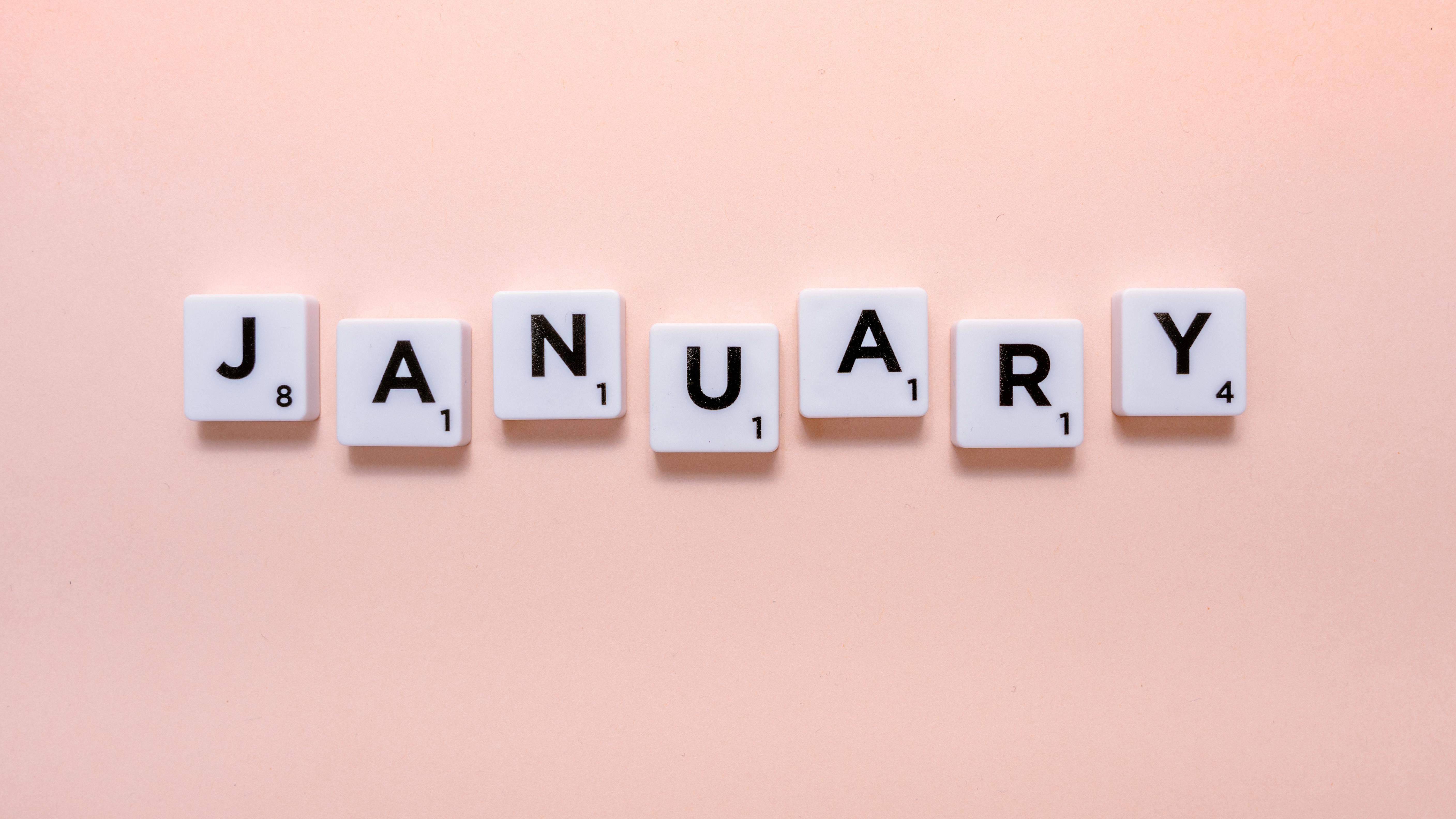 Handwriting of New Year's resolutions list on paper with pen, close-up.