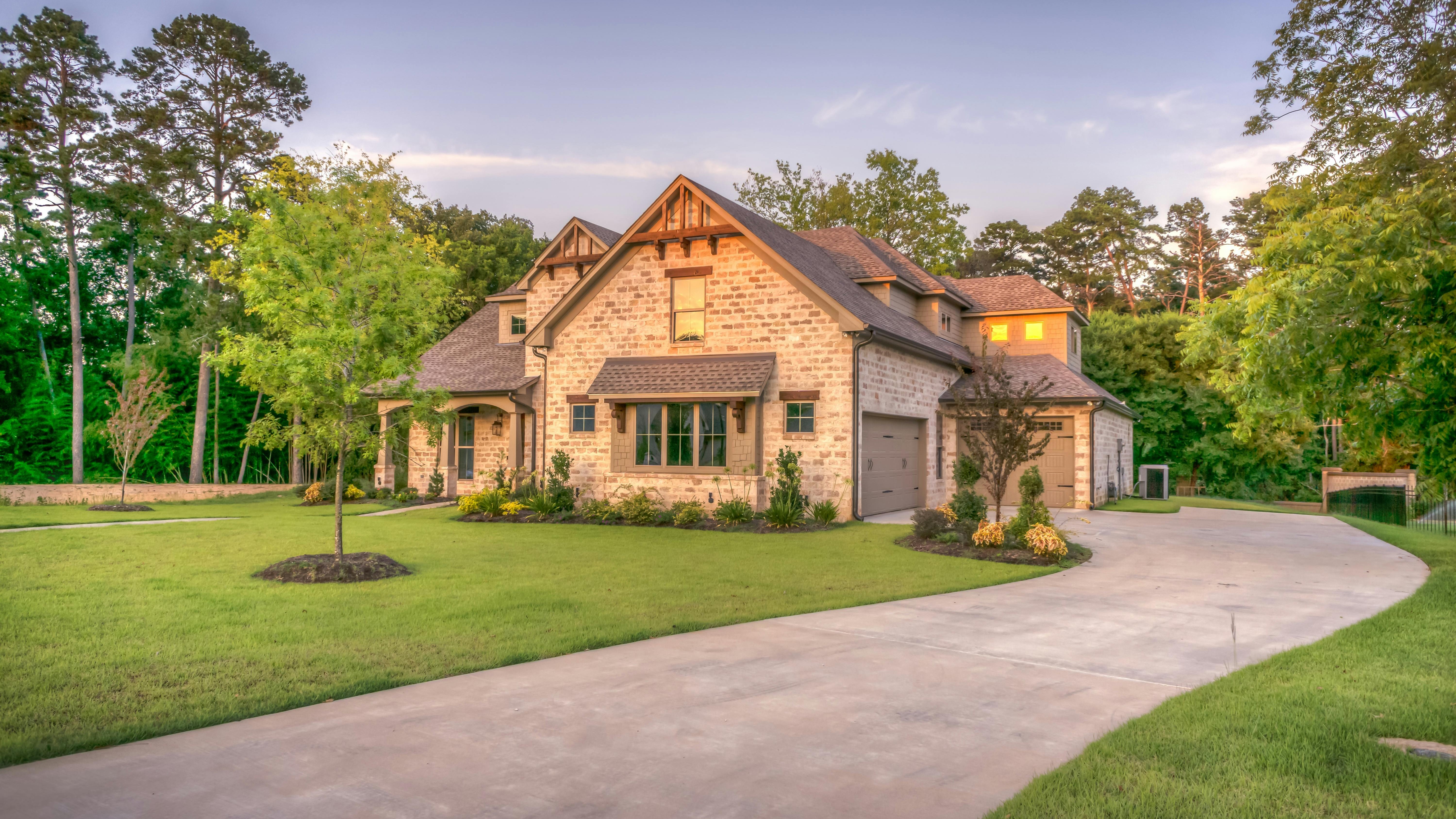 Family celebrating new home purchase with sold sign, Today's Mortgage Rates