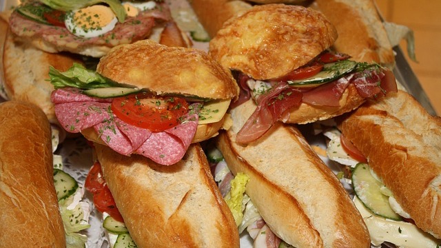 Exterior of affordable breakfast restaurant in Omaha with mural and signage